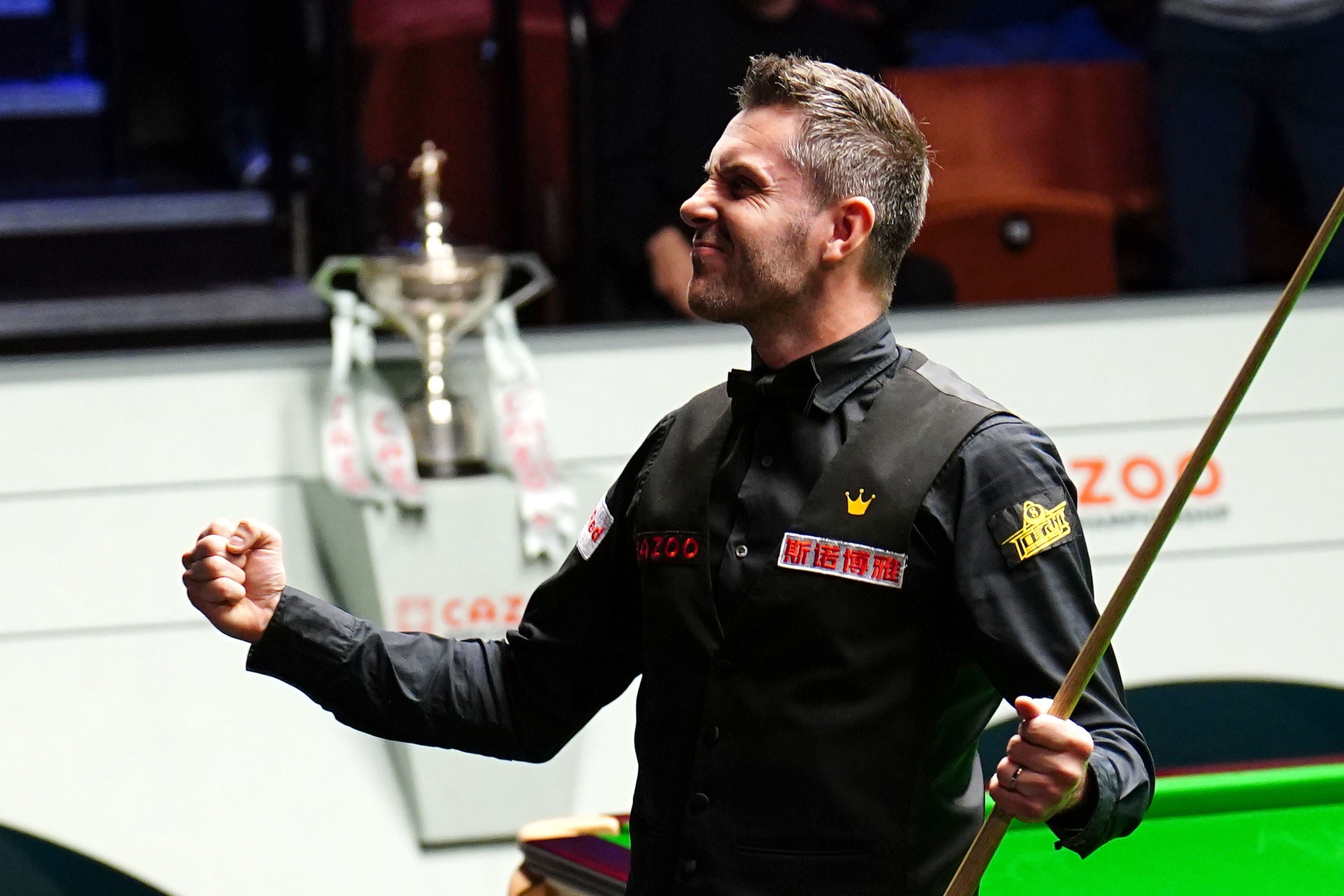 Mark Selby celebrates after completing a maximum break