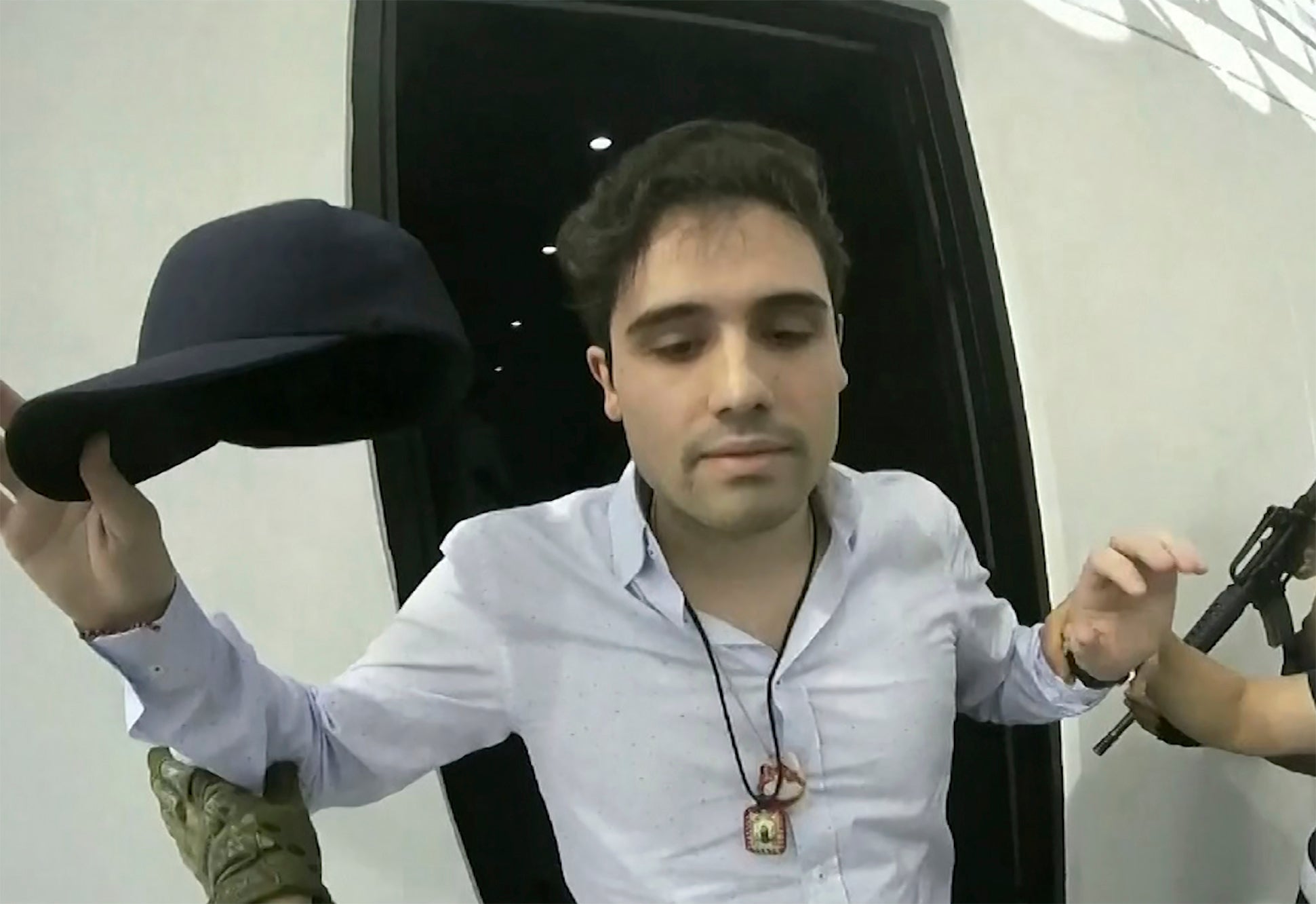 This frame grab from video, provided by the Mexican government, shows Ovidio Guzman Lopez being detained in Culiacan, Mexico, Oct. 17, 2019