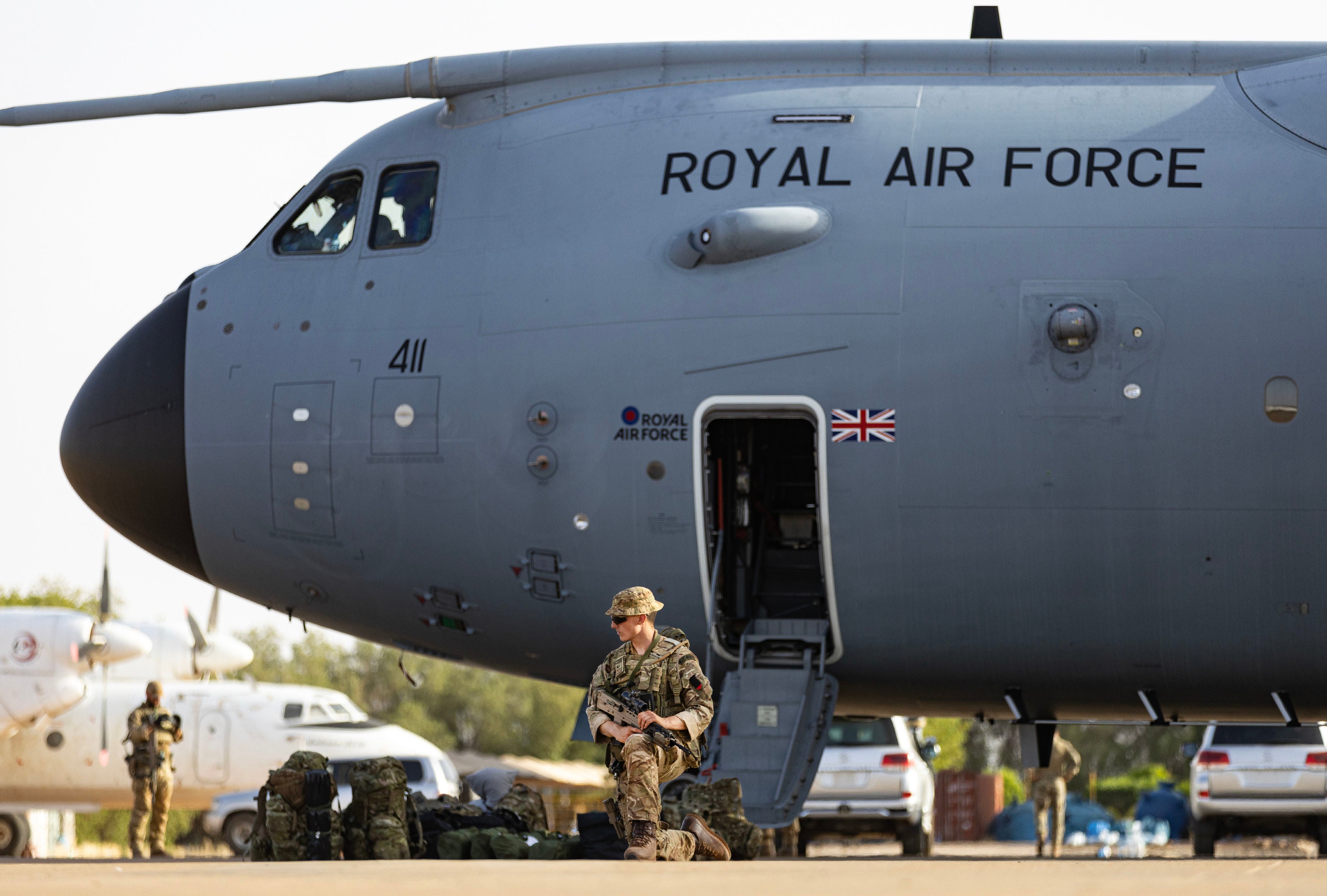 Evacuees and military personnel at Wadi Seidna airport in Khartoum, Sudan waiting to board an RAF aircraft bound for Cyprus on 29 April