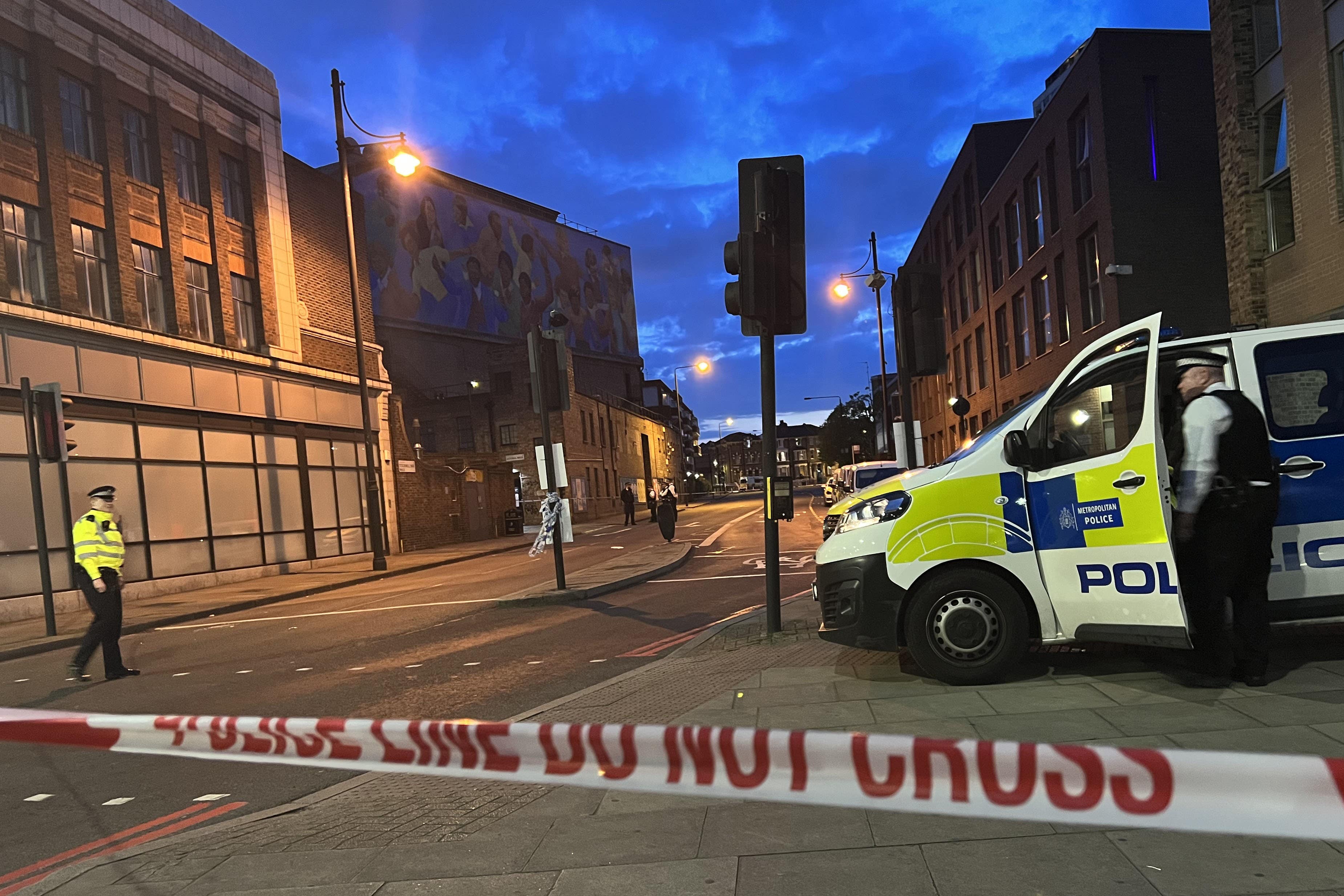 Police on Stockwell Park Walk in Lambeth (PA)