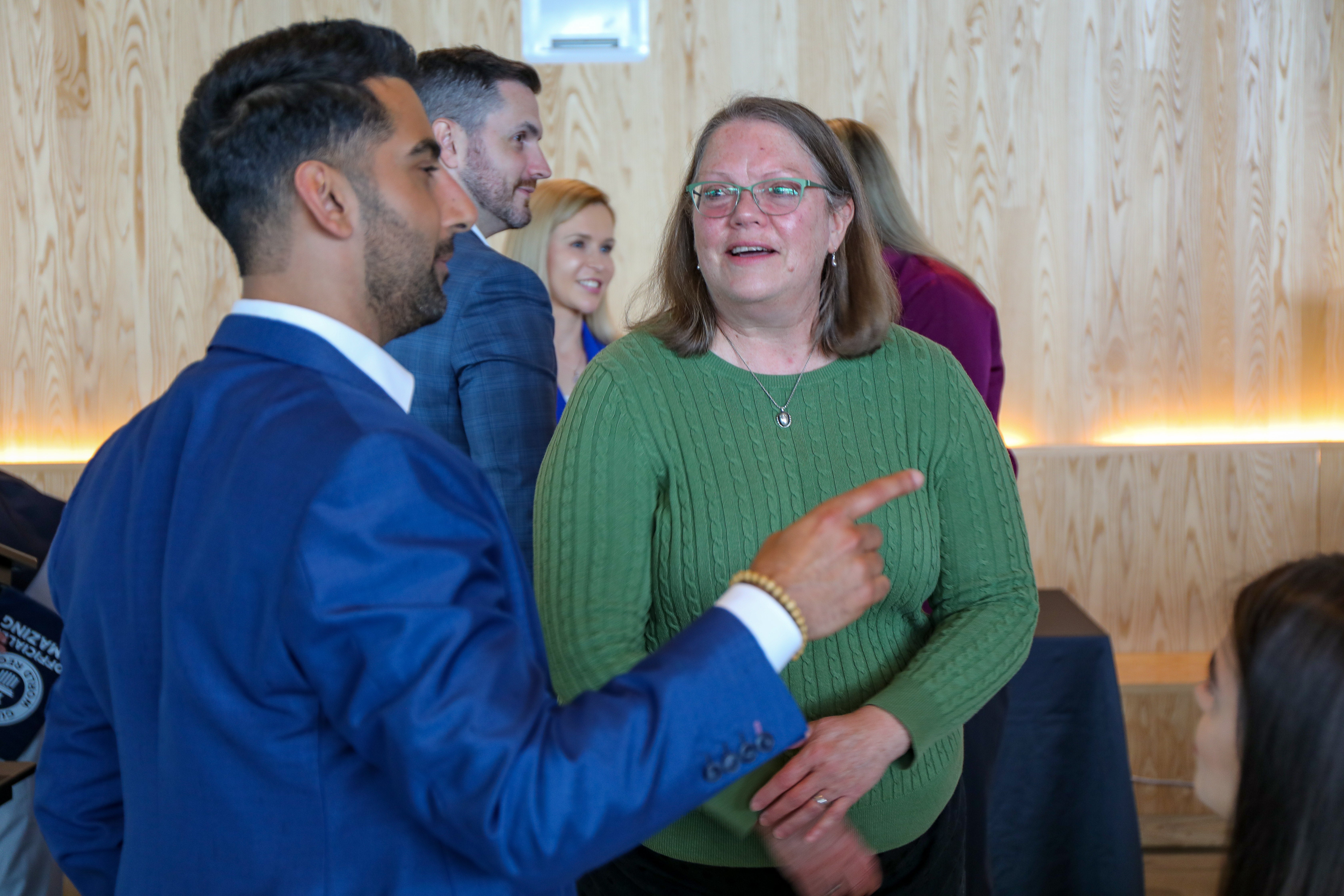 OHSU patient Christy Staats, right, speaks with an event attendee