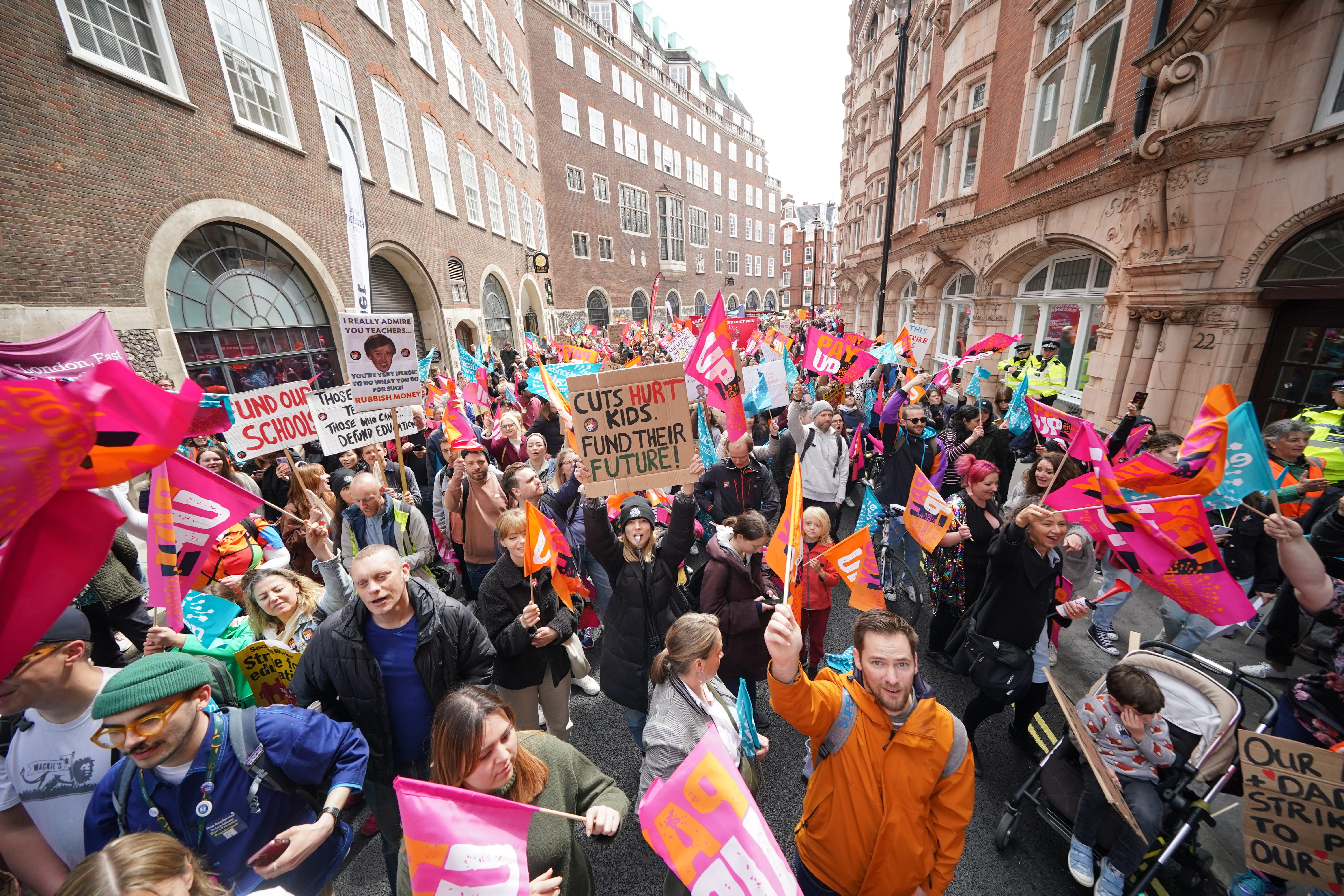 Teacher members of the National Education Union outside the Department for Education during a rally in central London (Yui Mok/PA)