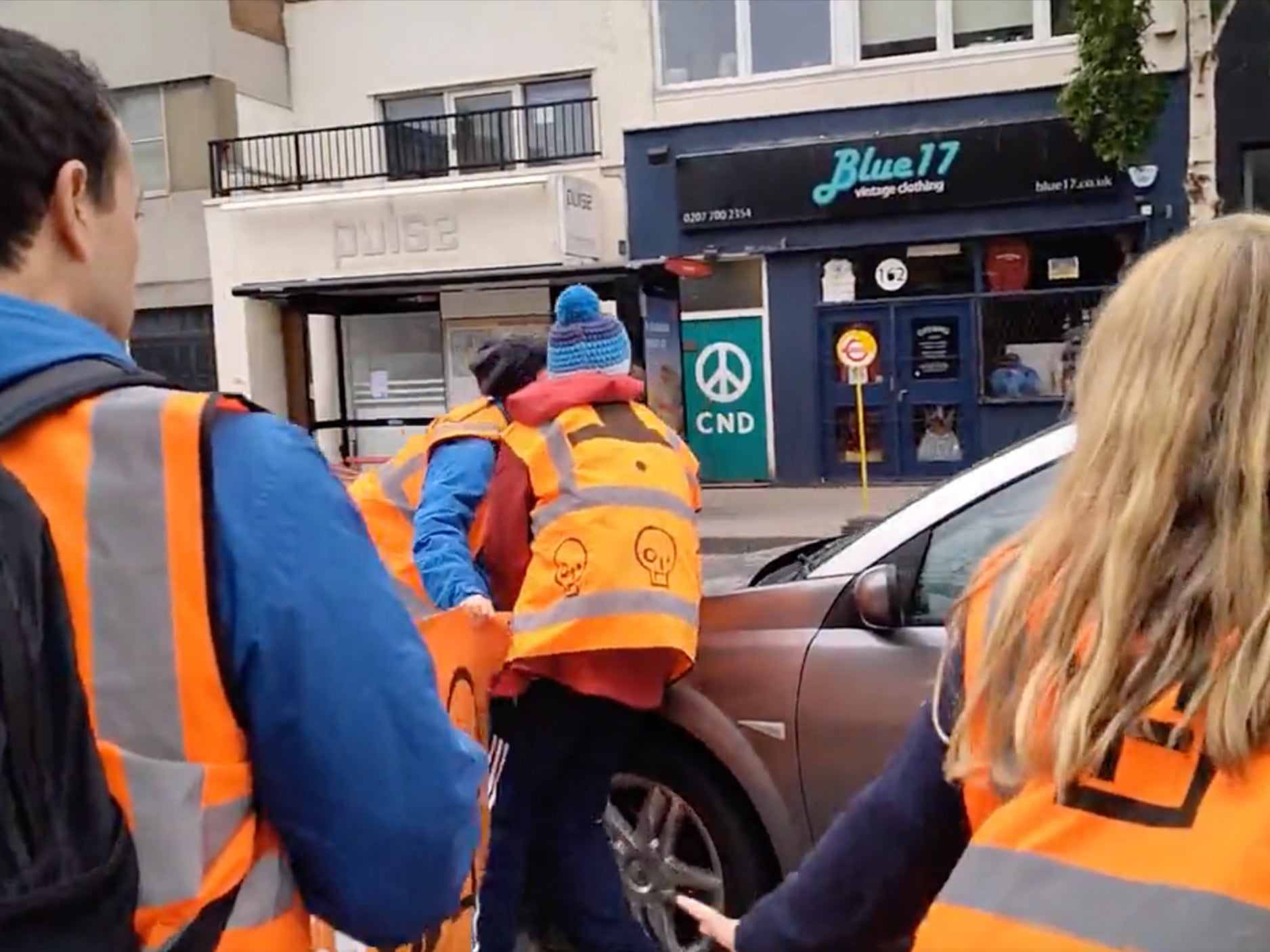 Moment motorist drives through Just Stop Oil protesters blocking road and ‘runs over woman’s foot’