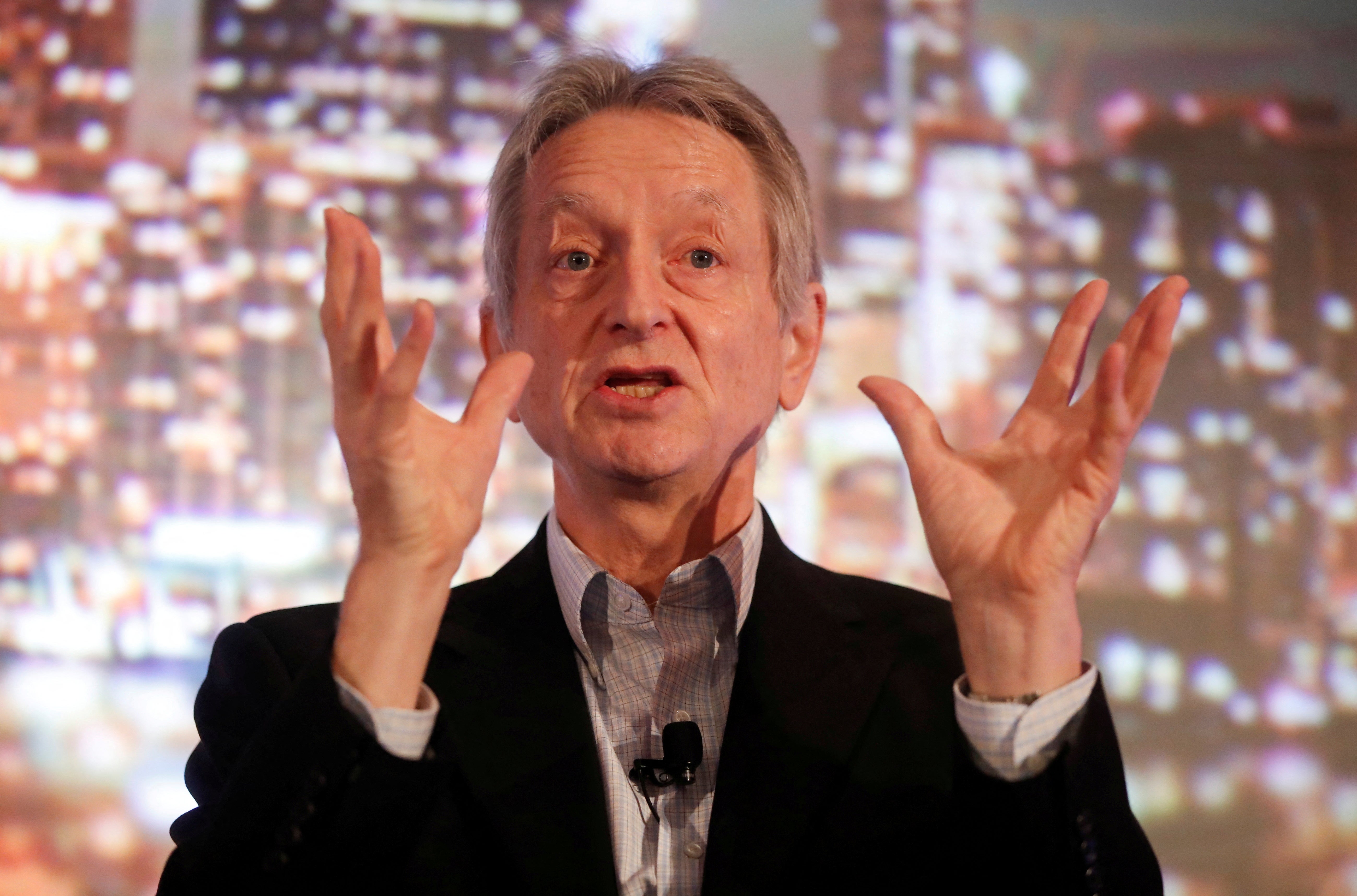 Artificial intelligence pioneer Geoffrey Hinton speaking at a summit in Toronto