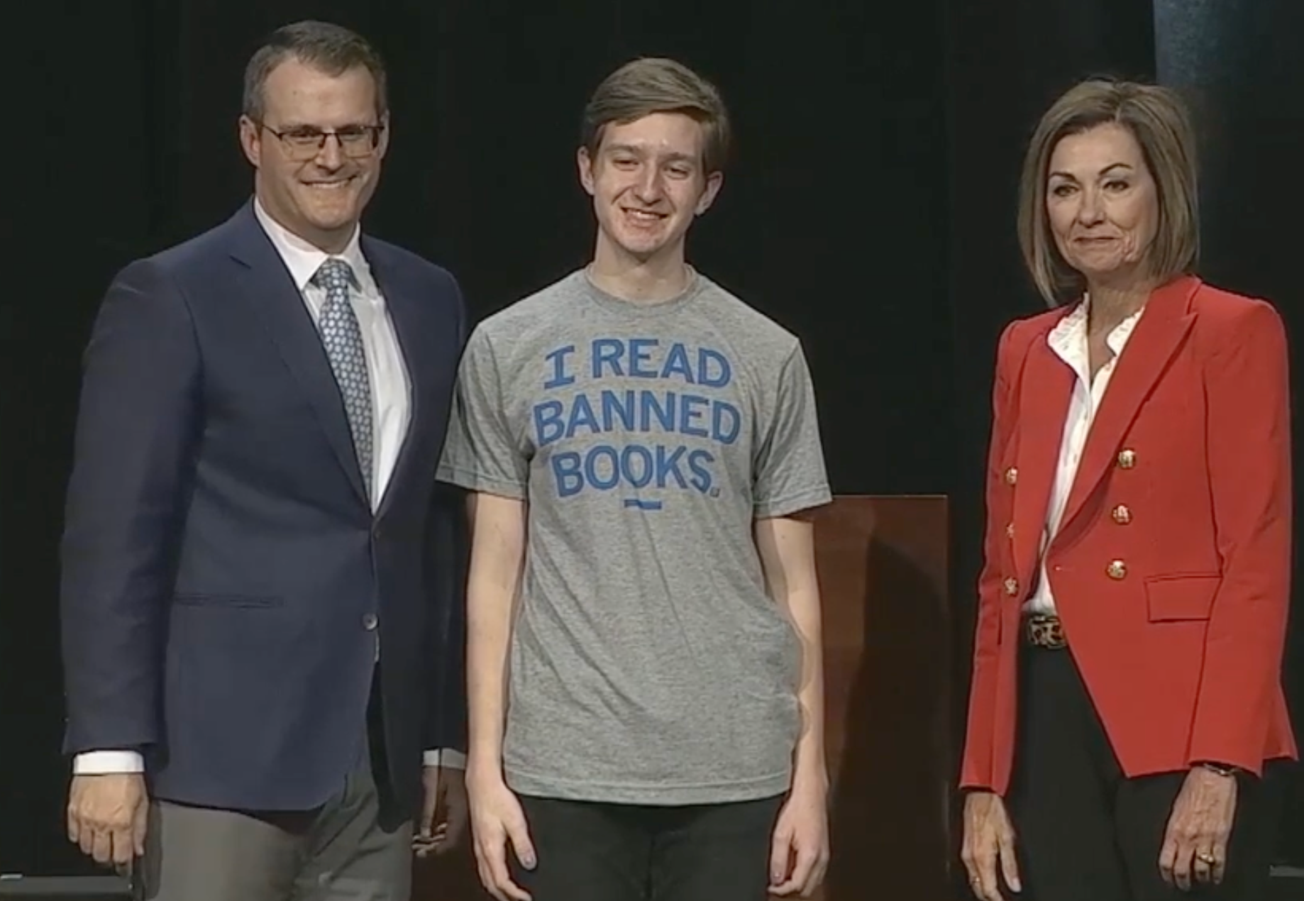 Leo Friedman of Newton High School posing for a photograph with Gov Kim Reynolds