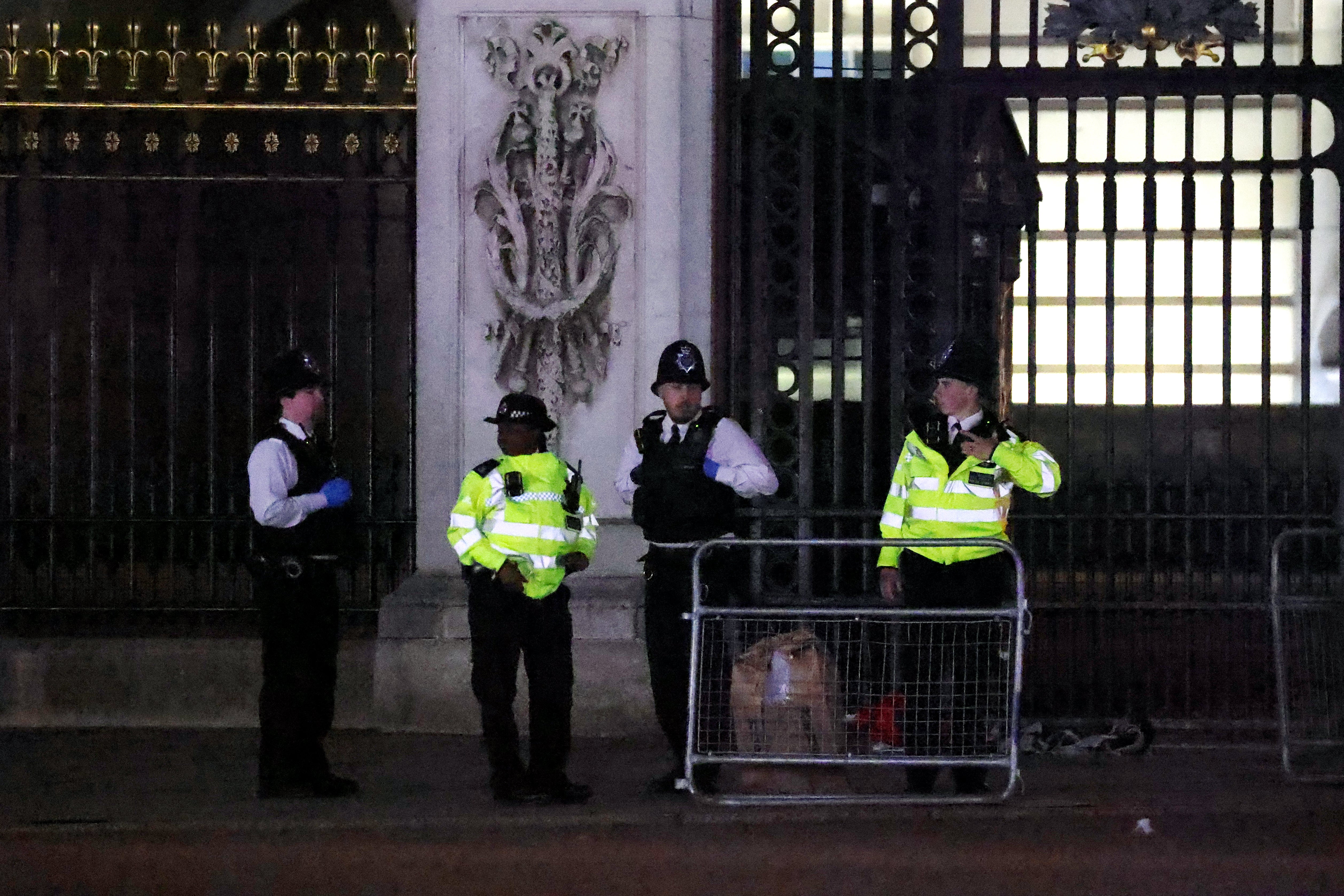 Police at the scene outside Buckingham Palace after a man was arrested and a subsequent controlled explosion was carried out