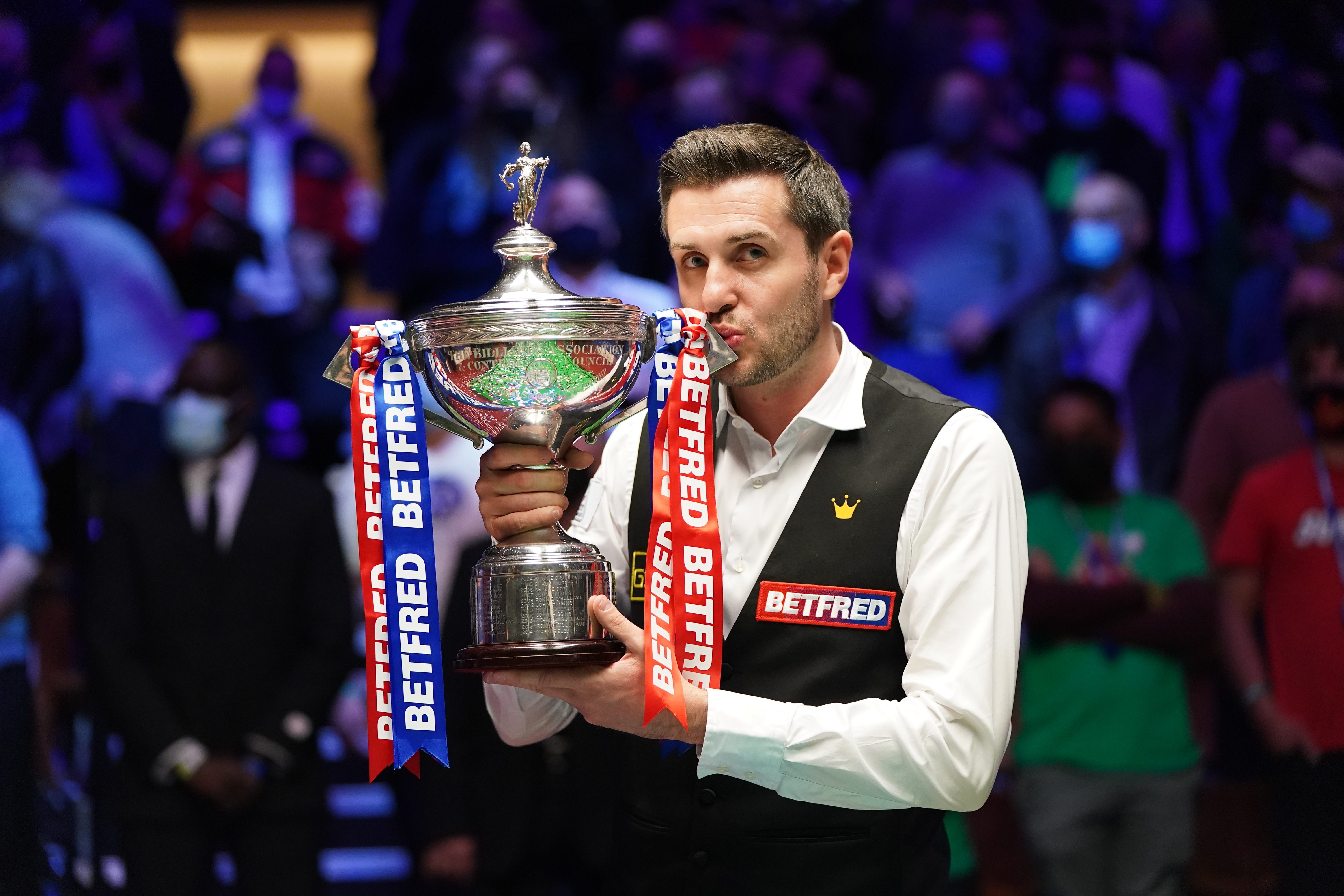 Mark Selby celebrates his 2021 world championship triumph in Sheffield (Zac Goodwin/PA)