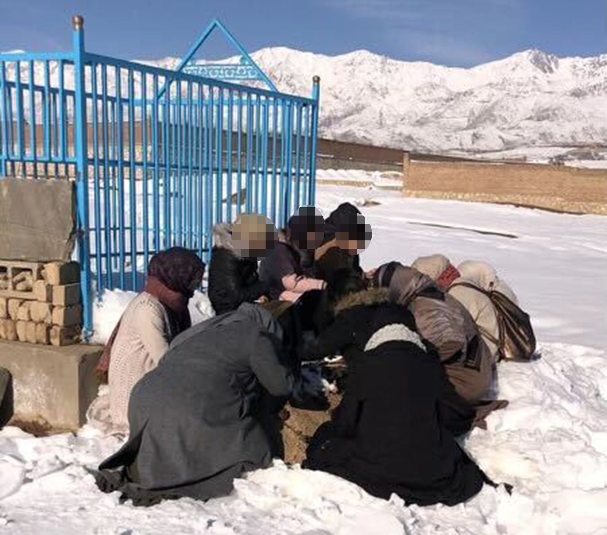 The children grieve for their father who was killed in a bomb blast