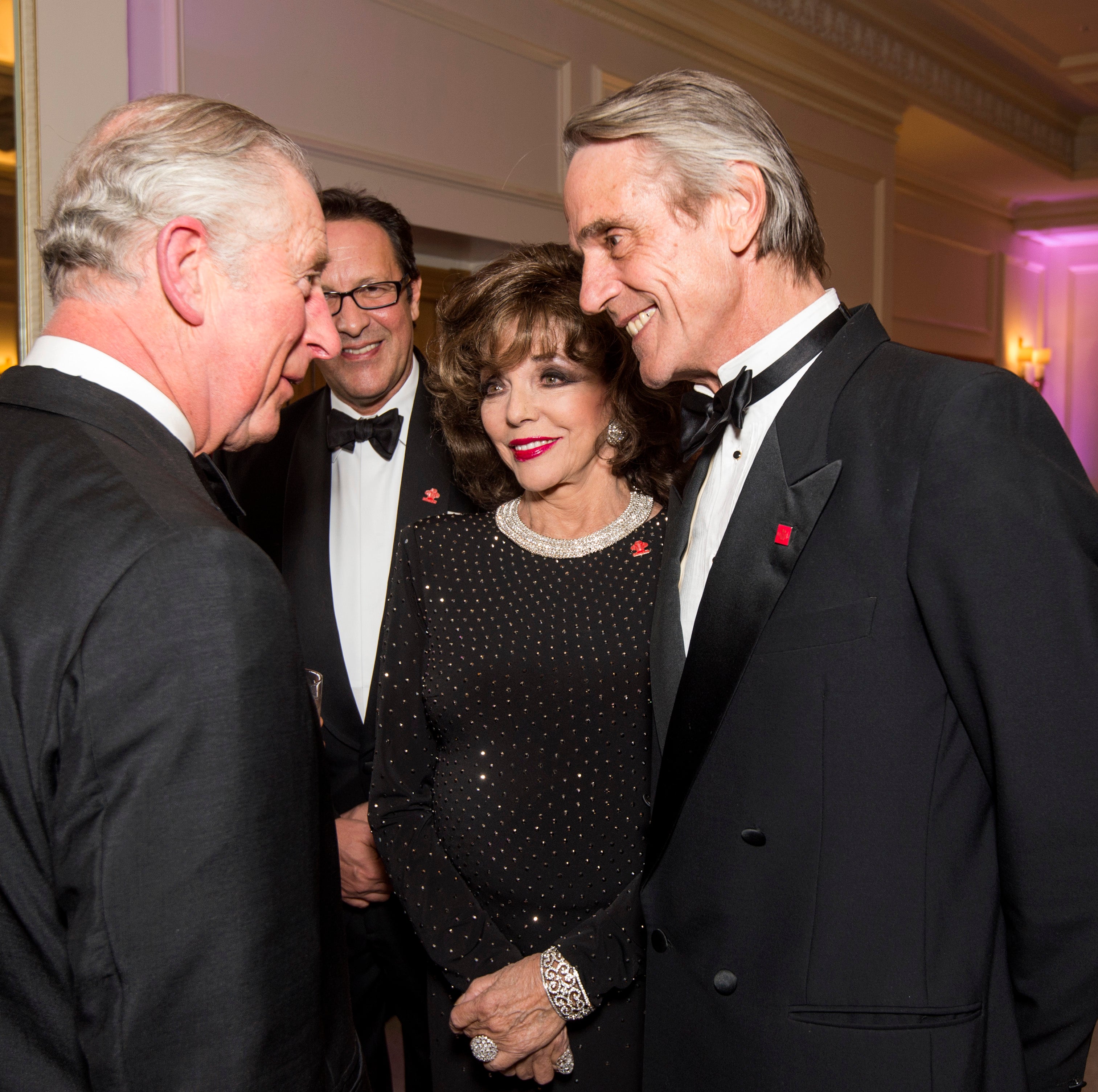 Prince Charles, Prince of Wales, President of The Princes Trust, chats to Joan Collins and Jeremy Irons as he attends the annual Princes Invest In Futures reception at The Savoy Hotel on February 9, 2017