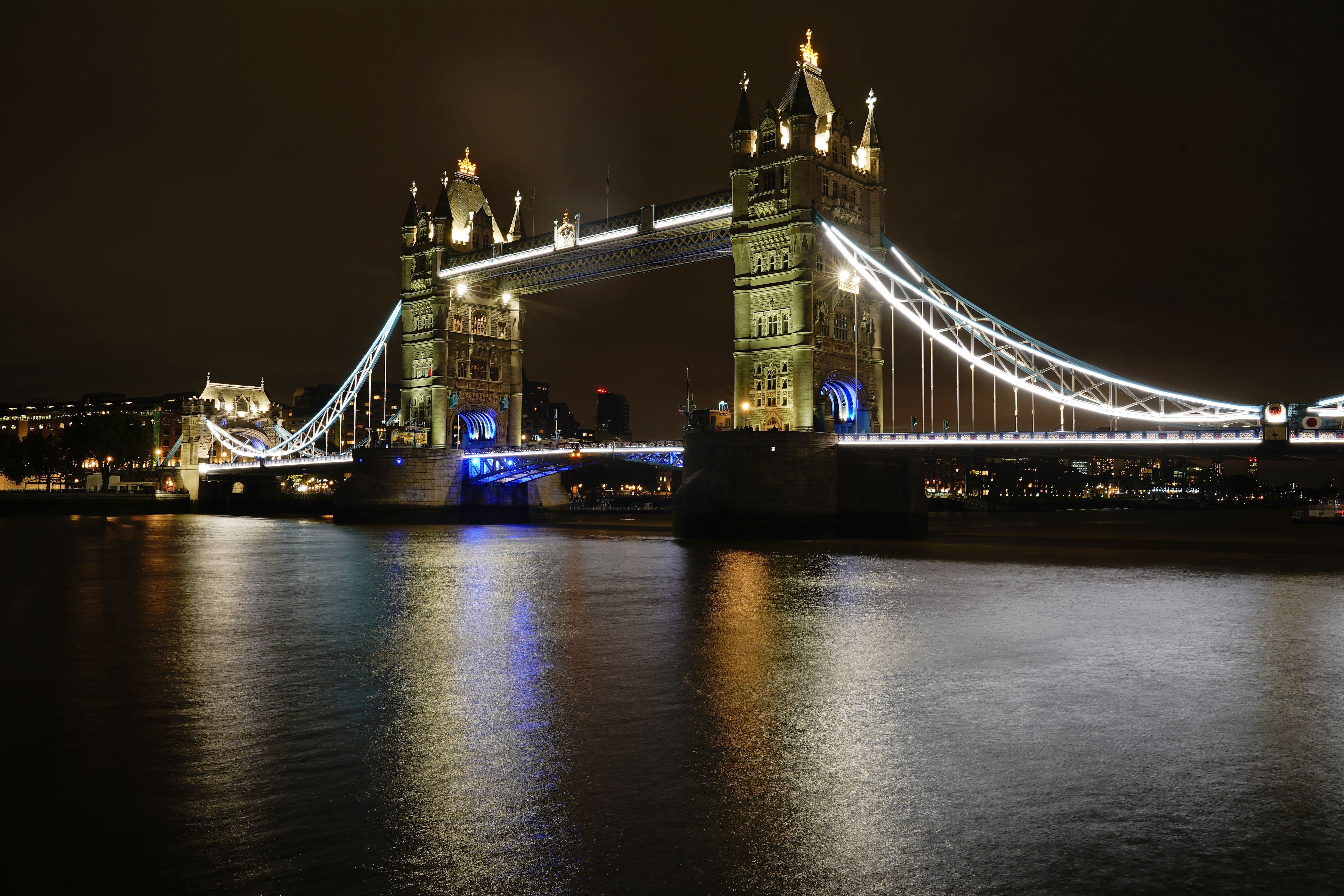 Tower Bridge in London is lit up at night. It will be bathed in red, white and blue light for the coronation weekend (Aaron Chown/PA)