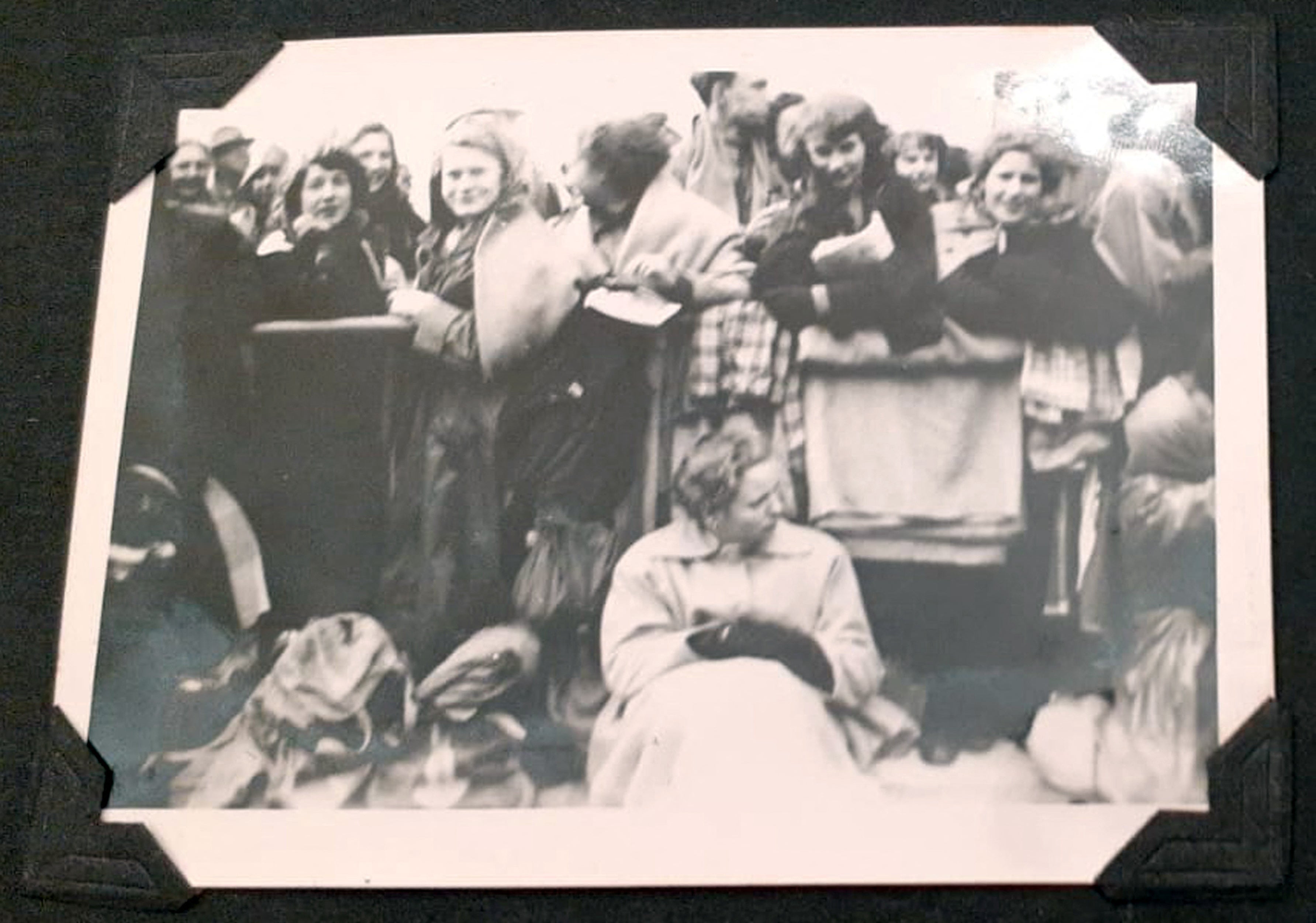 A photograph from 1953 of Brenda (back left) posing with her friends as they wait for the procession of Queen Elizabeth II's Coronation to pass by in Piccadilly