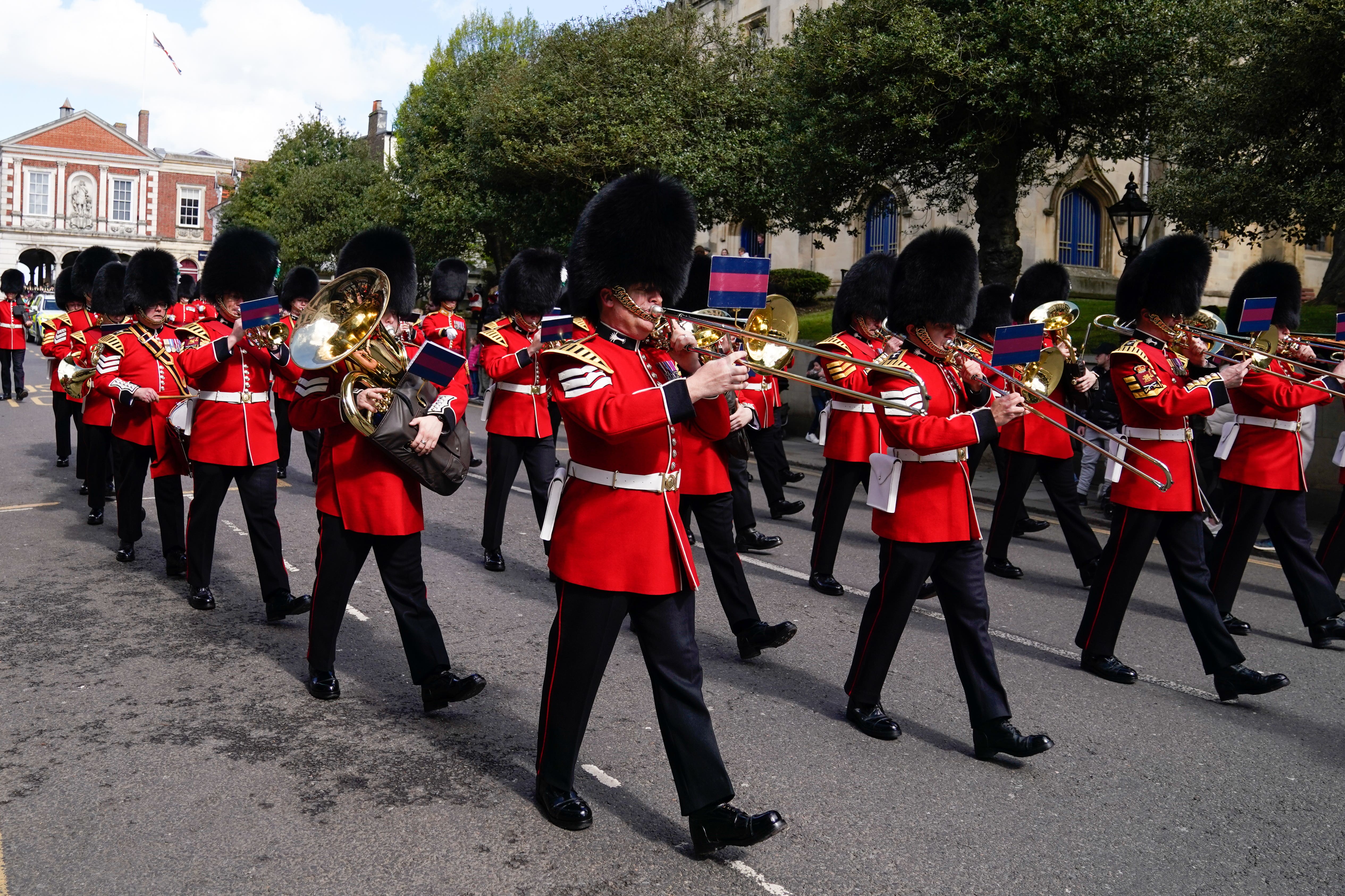 The band of the Welsh Guards march down the High Street towards Victoria barracks in Windsor after a changing of the guards ceremony at Windsor Castle (Andrew Matthews/PA)