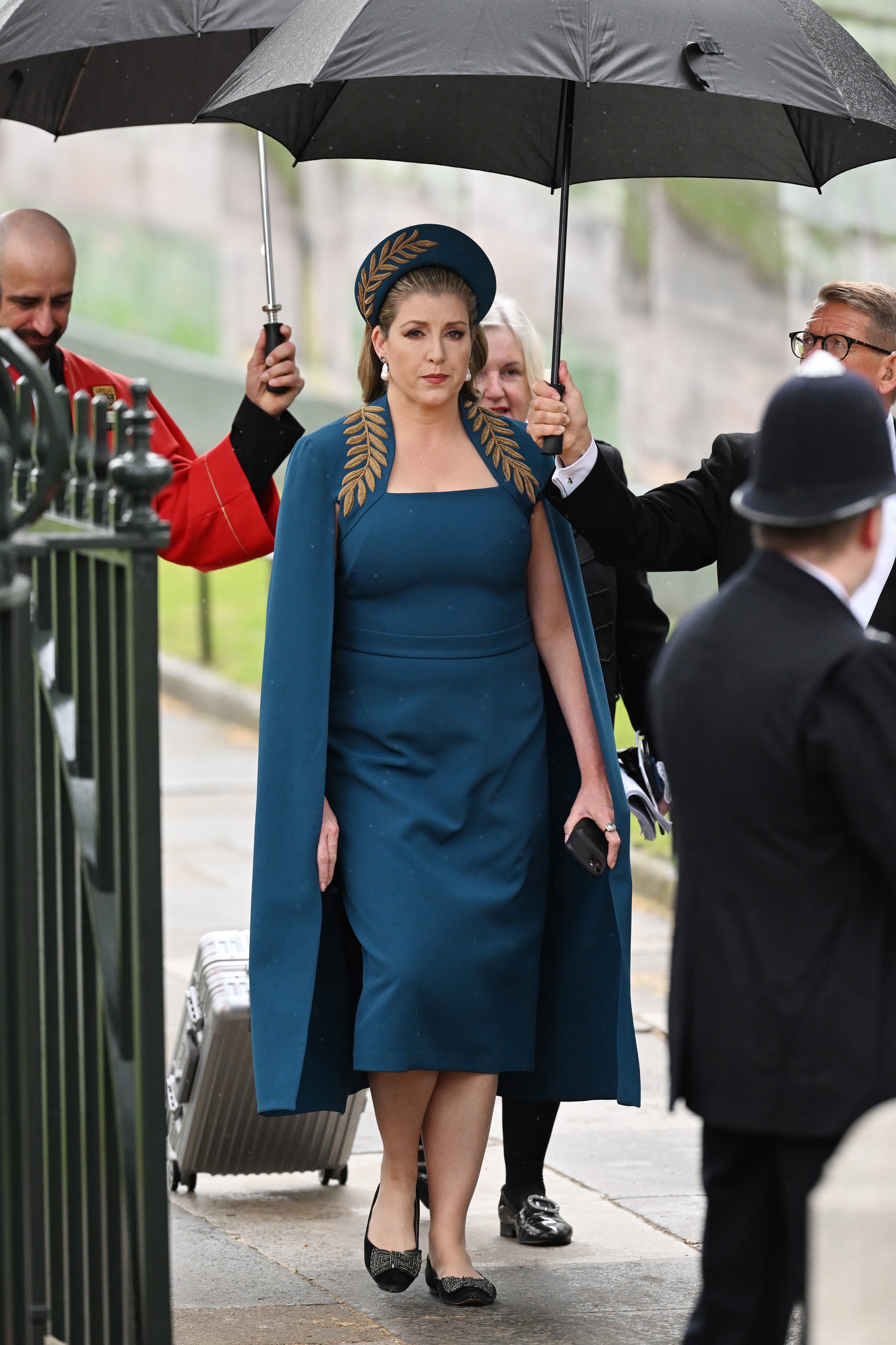 Mordaunt dazzled in a leaf-printed deep teal dress and cape