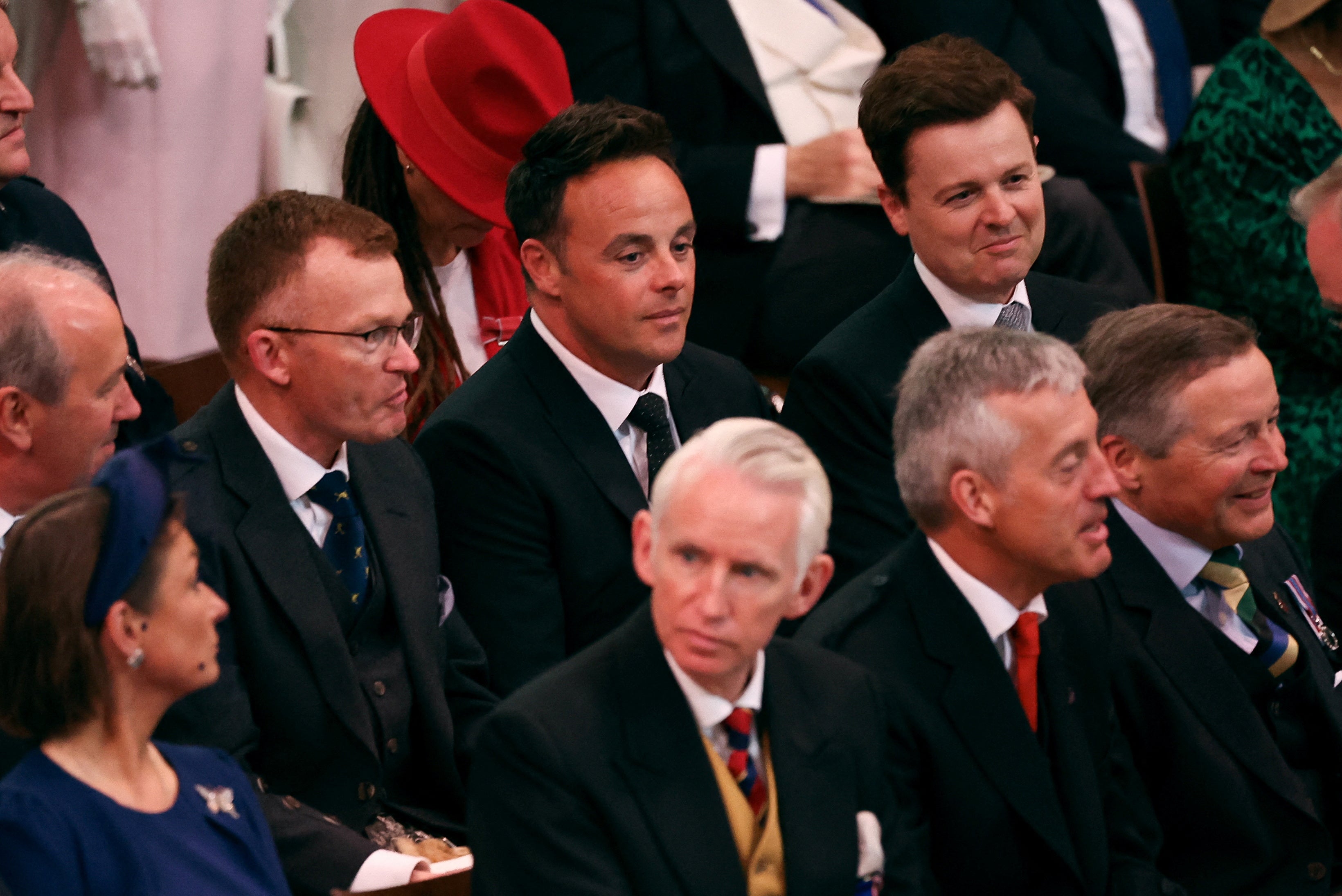 TV presenters And and Dec take their seats inside in the packed church