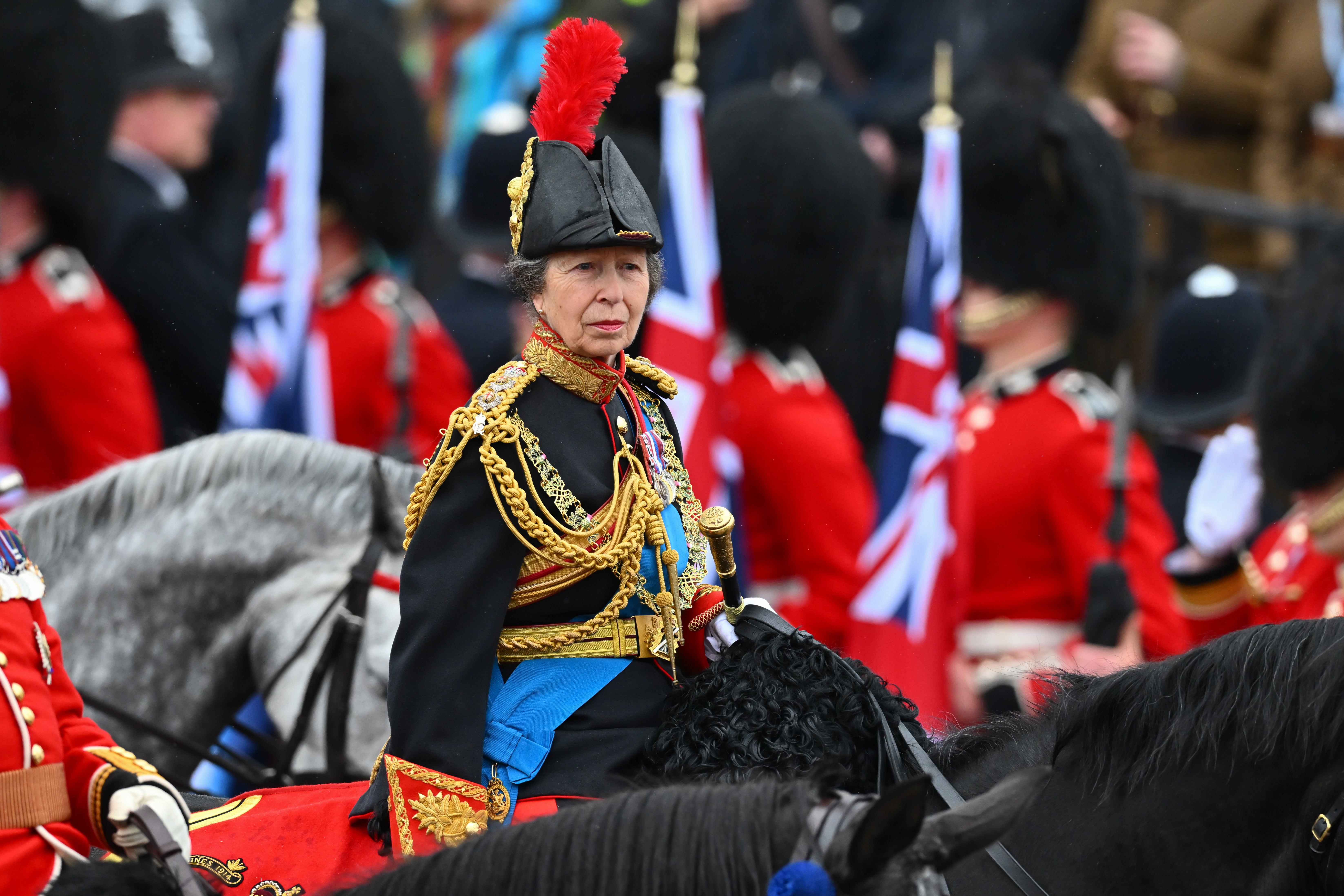 Princess Anne, Princess Royal rides on horseback behind the gold state coach carrying the newly crowned King and Queen Consort as they travel down The Mall