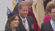 Prince Harry smiles as he leaves King Charles’s coronation