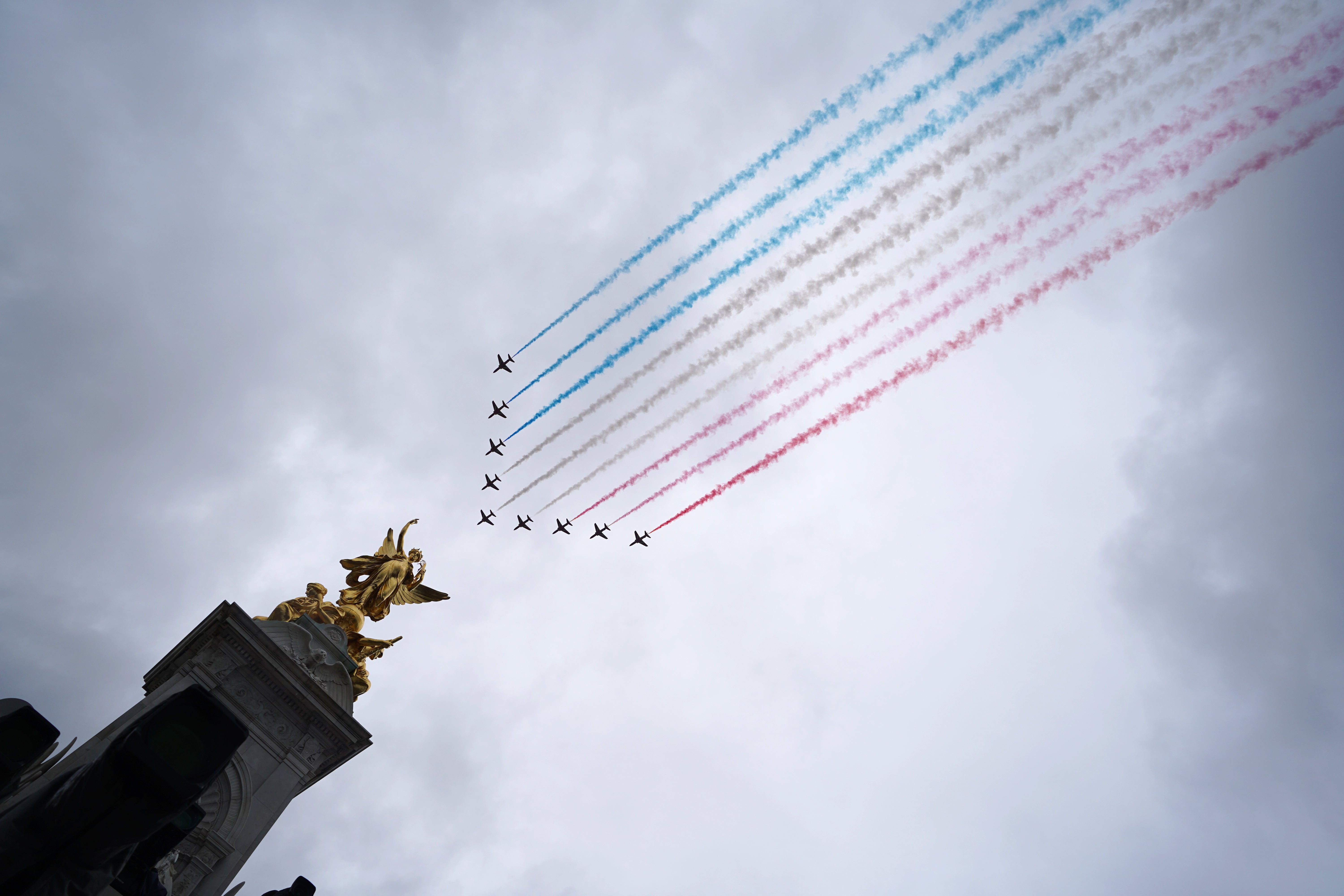 The flypast was scaled back but the Red Arrows still made an appearance