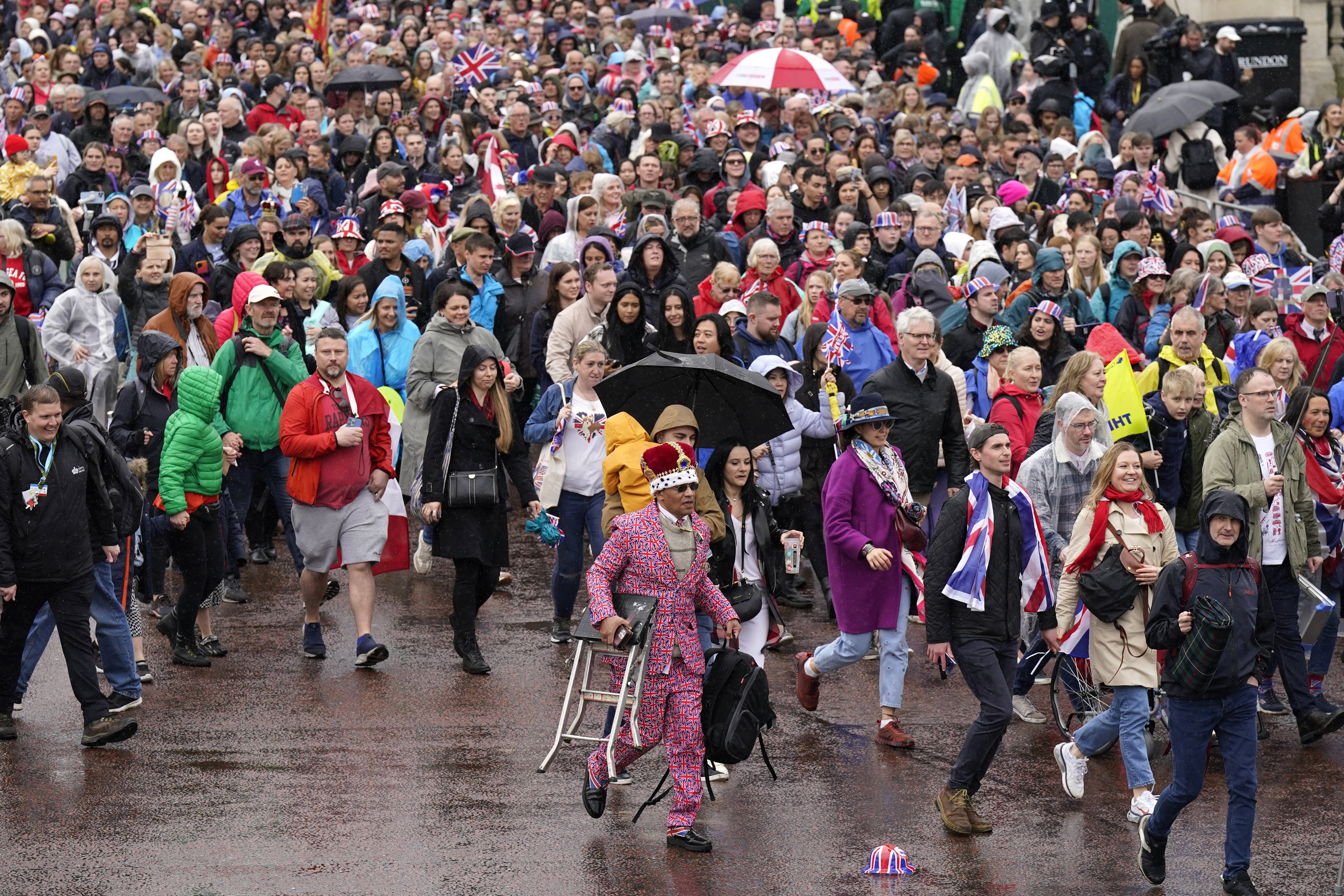 Crowds fill the Mall following the coronation of King Charles III and Queen Camilla, ahead of the King and Queen's appearance on the balcony at Buckingham Palace