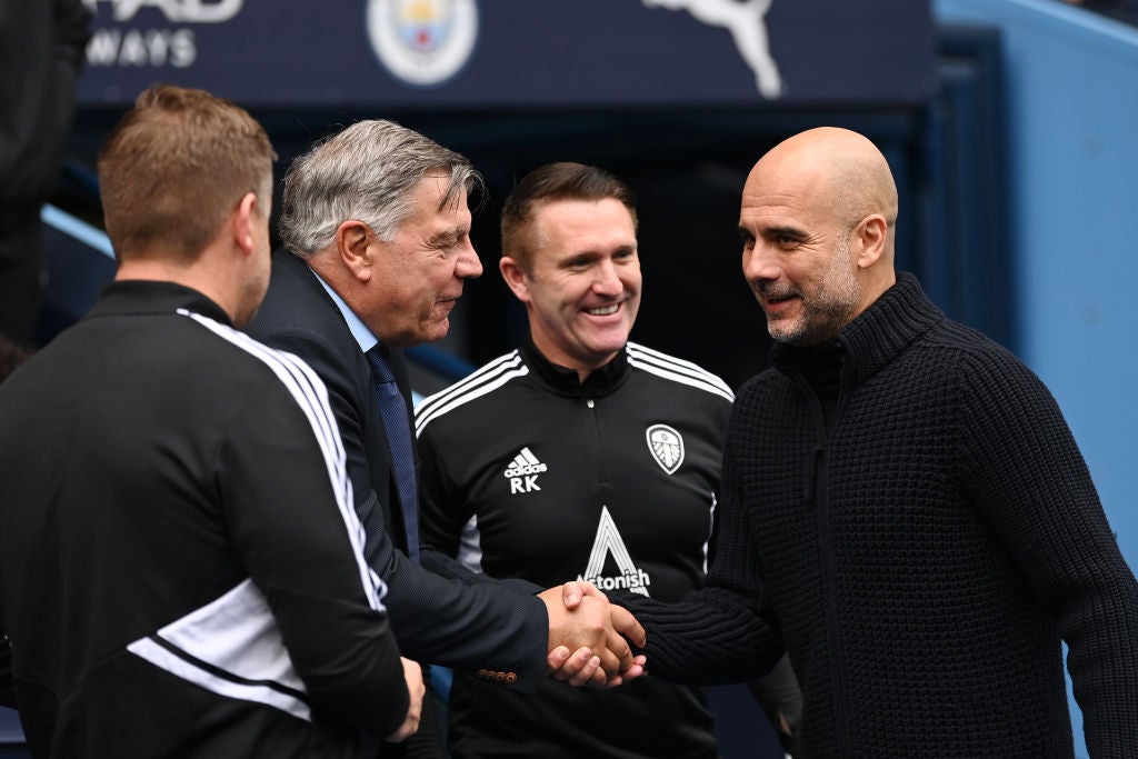 The two managers exchange pleasantries after the match