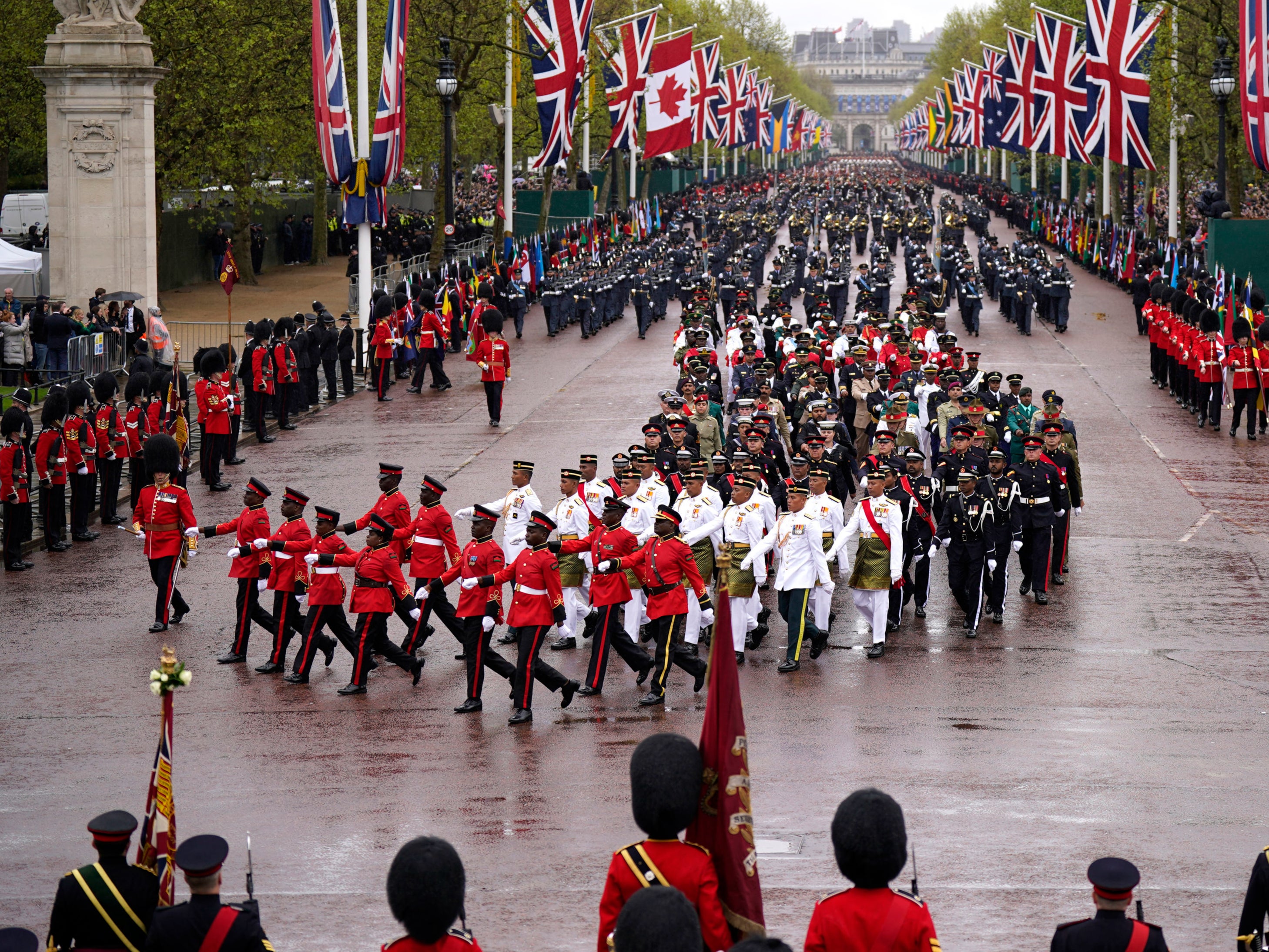 The Coronation Procession passes along The Mall to Buckingham Palace