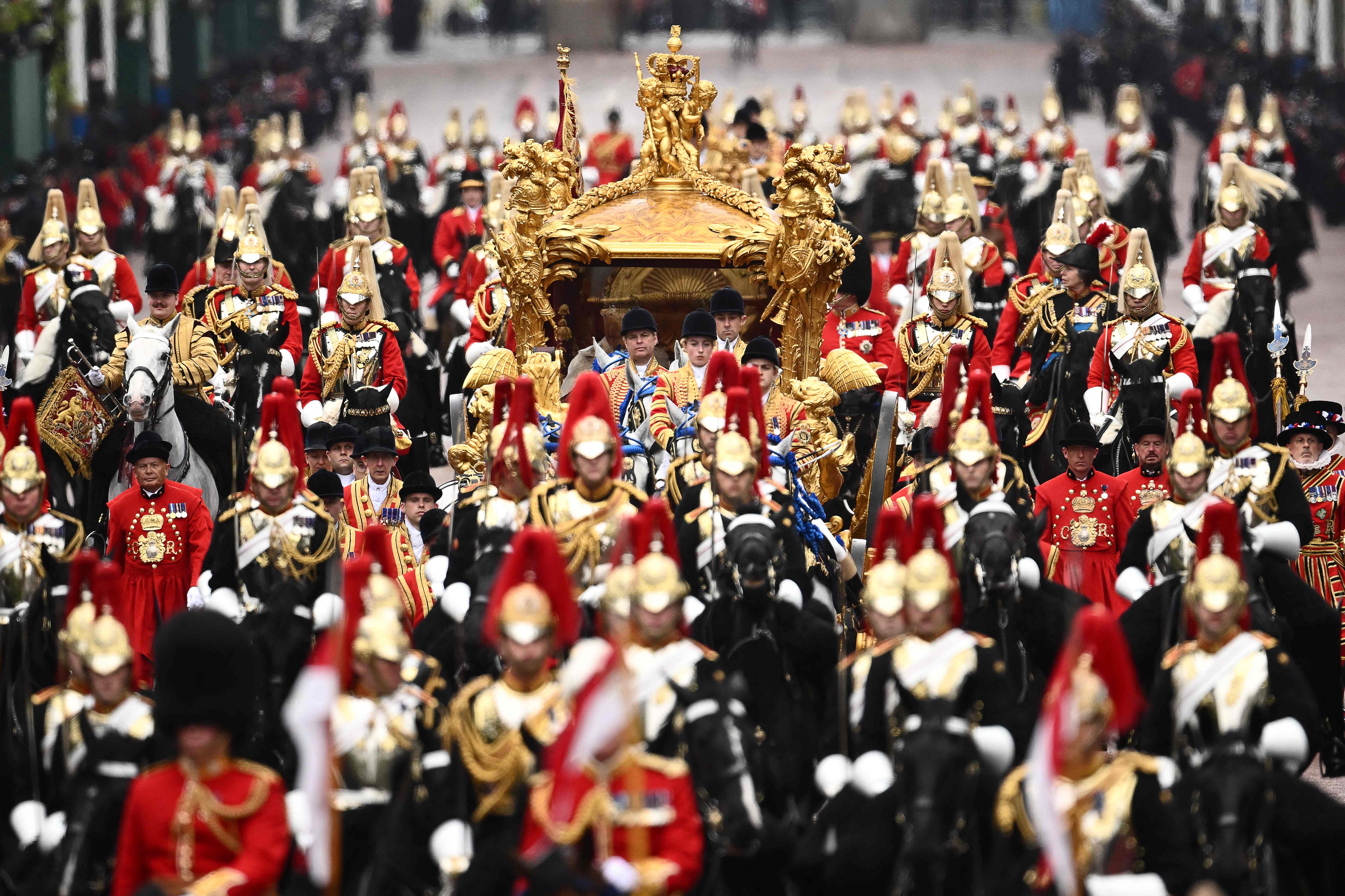 Queen Camilla and King Charles III travel in the Gold State Coach, back to Buckingham Palace