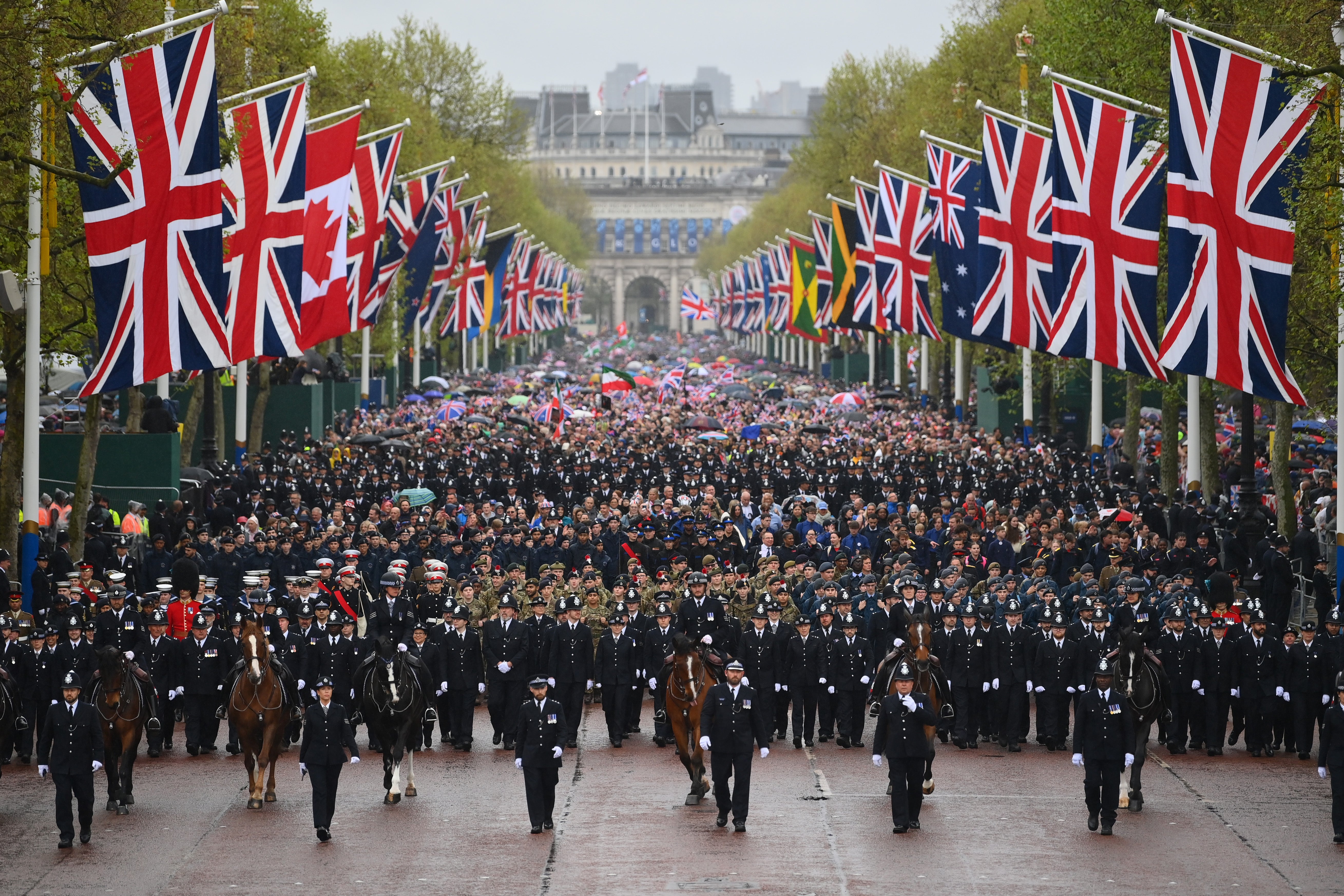 The military procession makes its way down The Mall towards Buckingham Palace