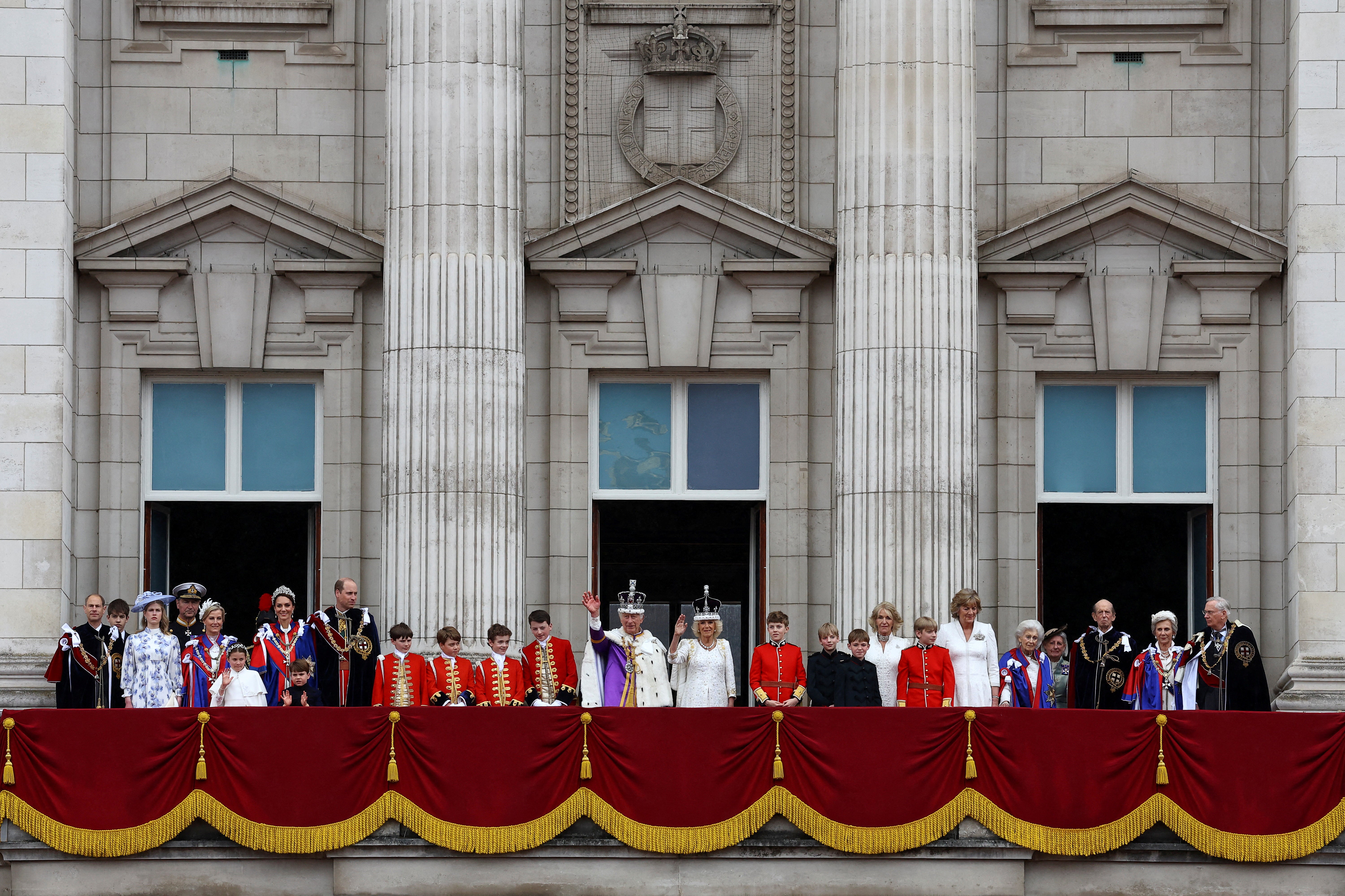 King Charles and Queen Camilla, along with other members of the Royal family, stand on the Buckingham Palace balcony following their coronation ceremony