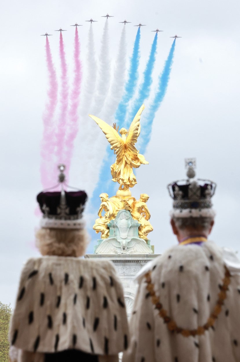 King Charles III and Queen Camilla watch the flypast from the balcony