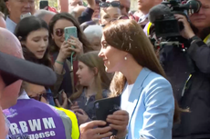 Prince William and Princess Kate joke with children as they greet royal fans at Windsor Castle