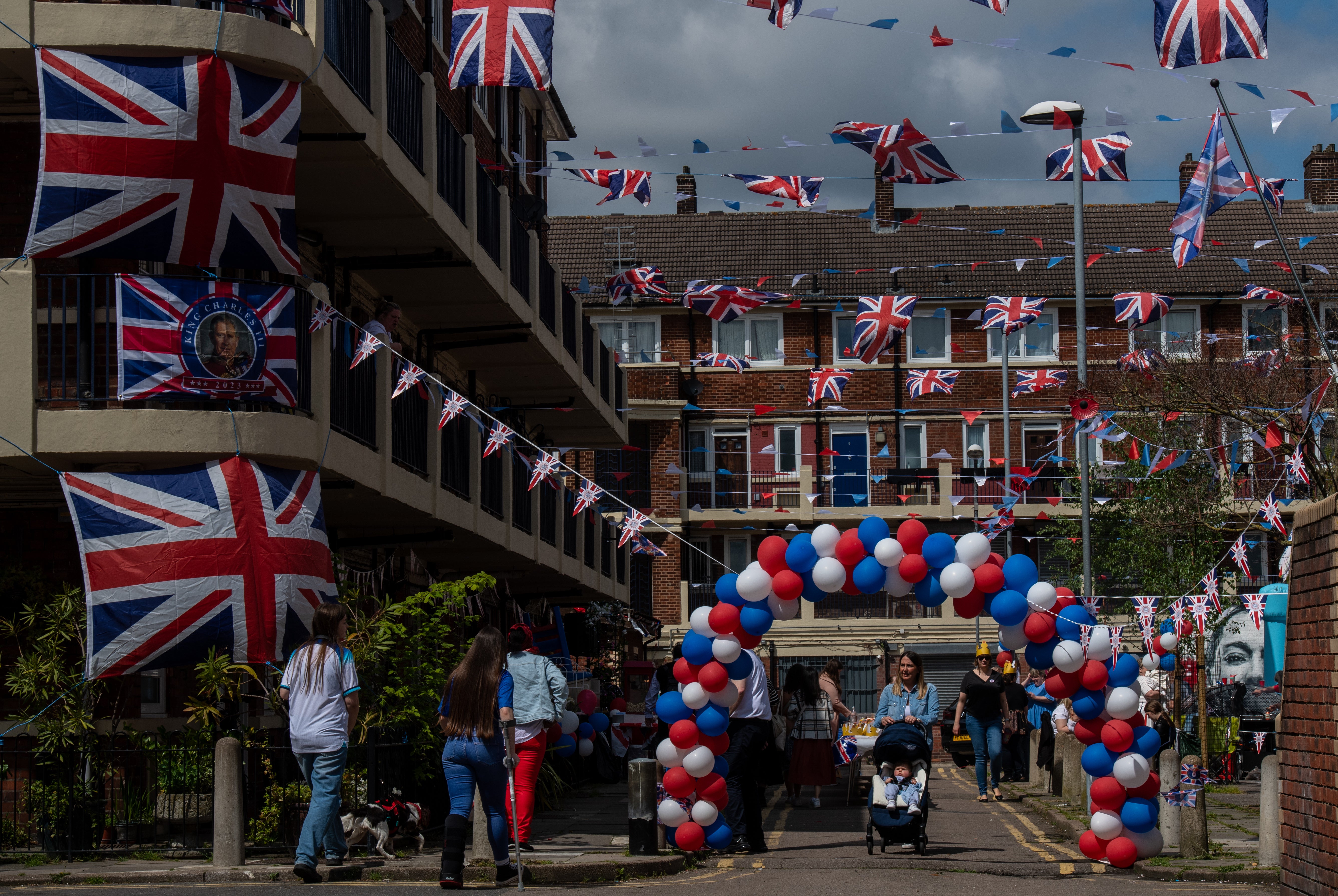 Residents of the Kirby estate in Bermondsey have a street party with a BBQ, drinks and a bouncy castle