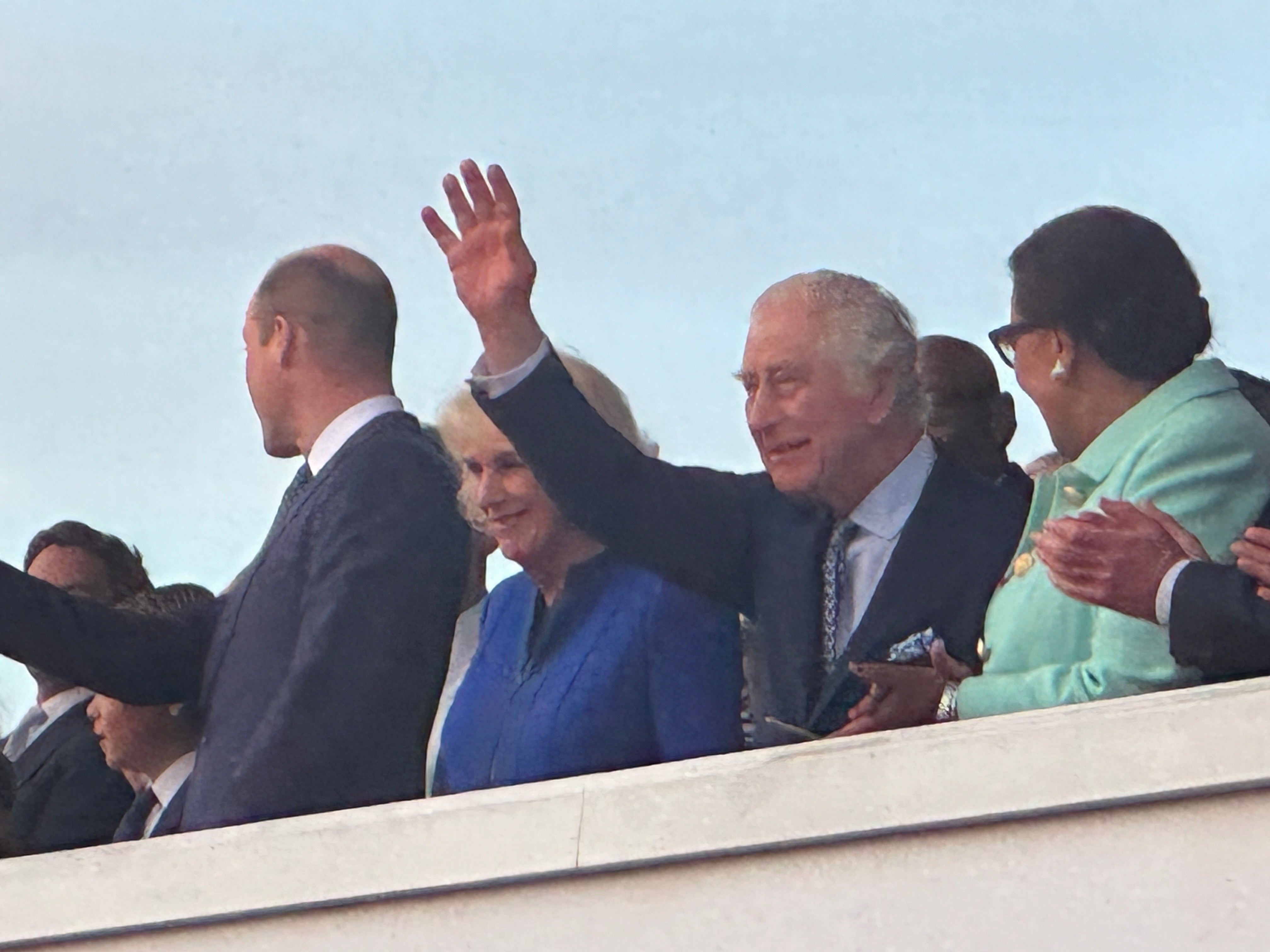 Charles and Camilla wave to the crowds