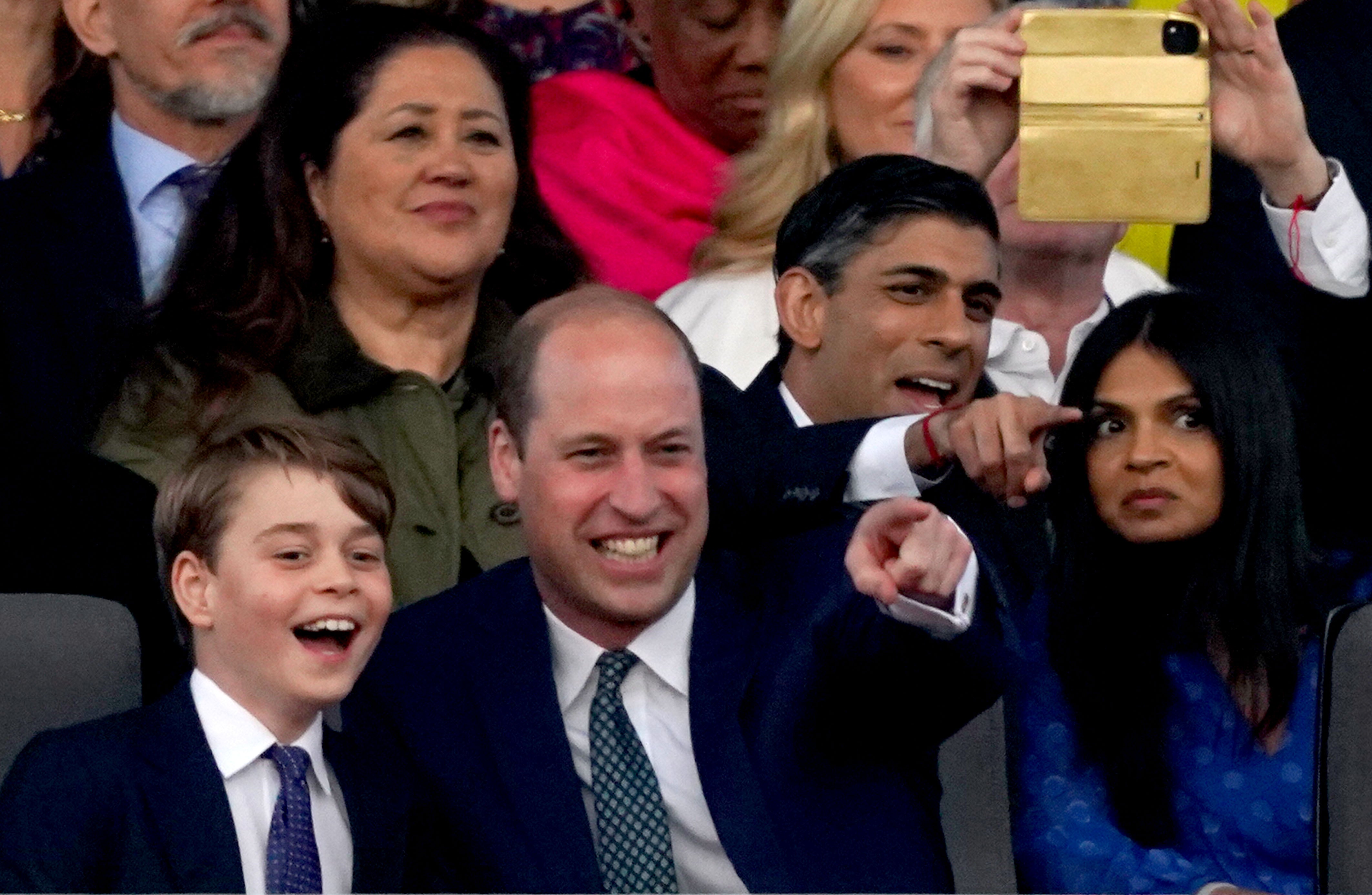 Prince George and Prince William, beside Rishi Sunak and wife Akshata Murty, enjoy the show