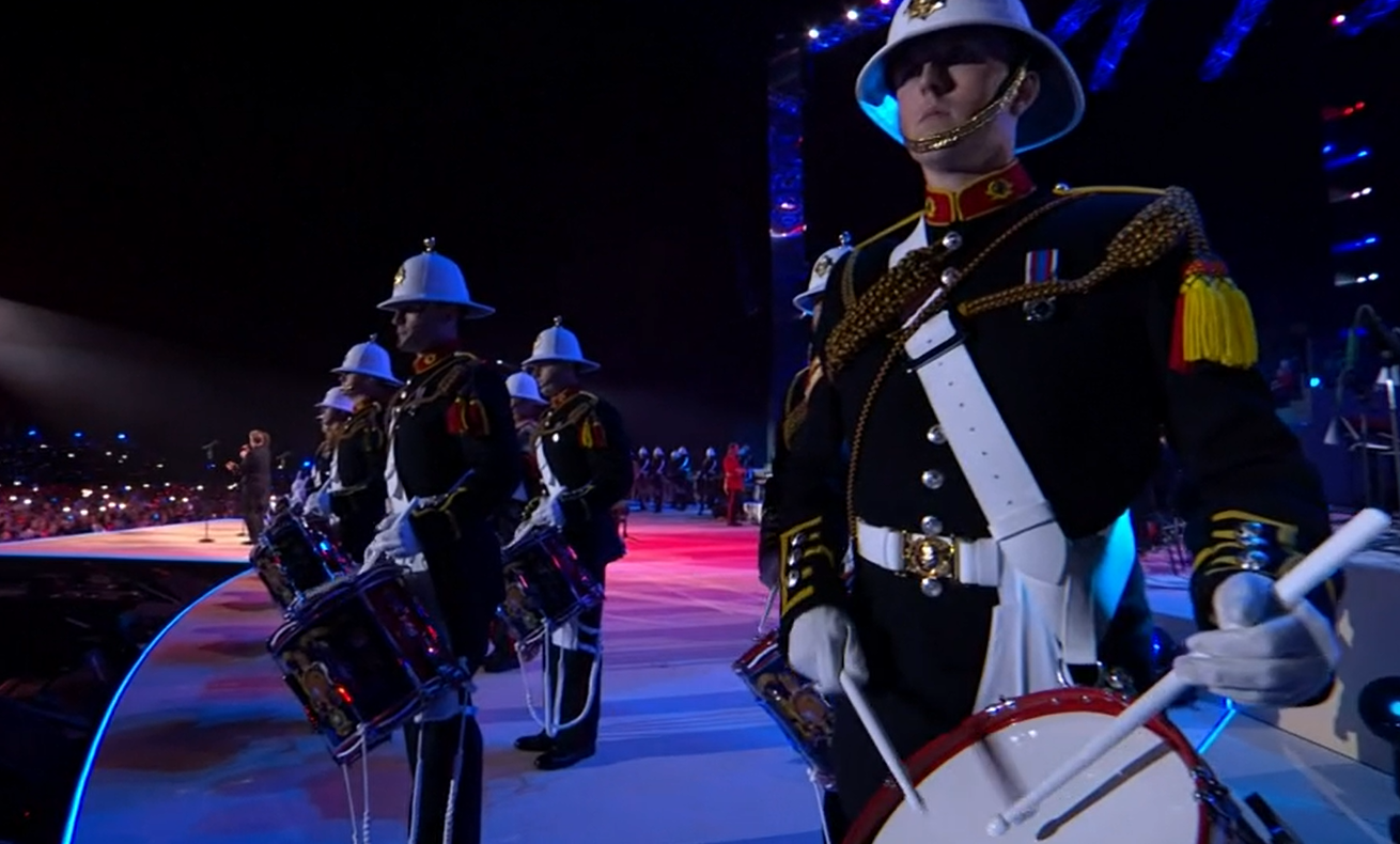 The marching band accompanying Take That