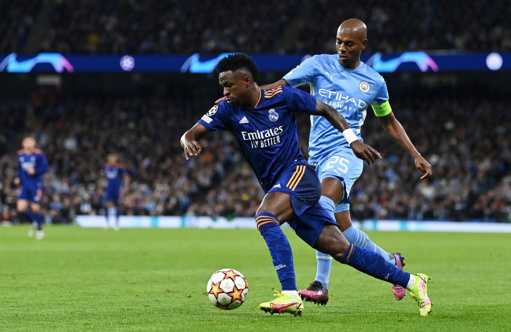 Real Madrid’s Vinicius Junior is shadowed by Manchester City’s Fernandinho in last year’s semi-final first leg at the Etihad