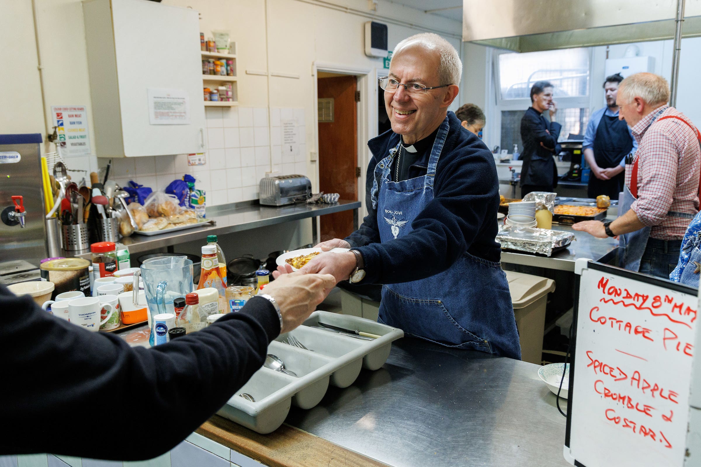 The Archbishop of Canterbury serves lunch at Catching Lives open centre