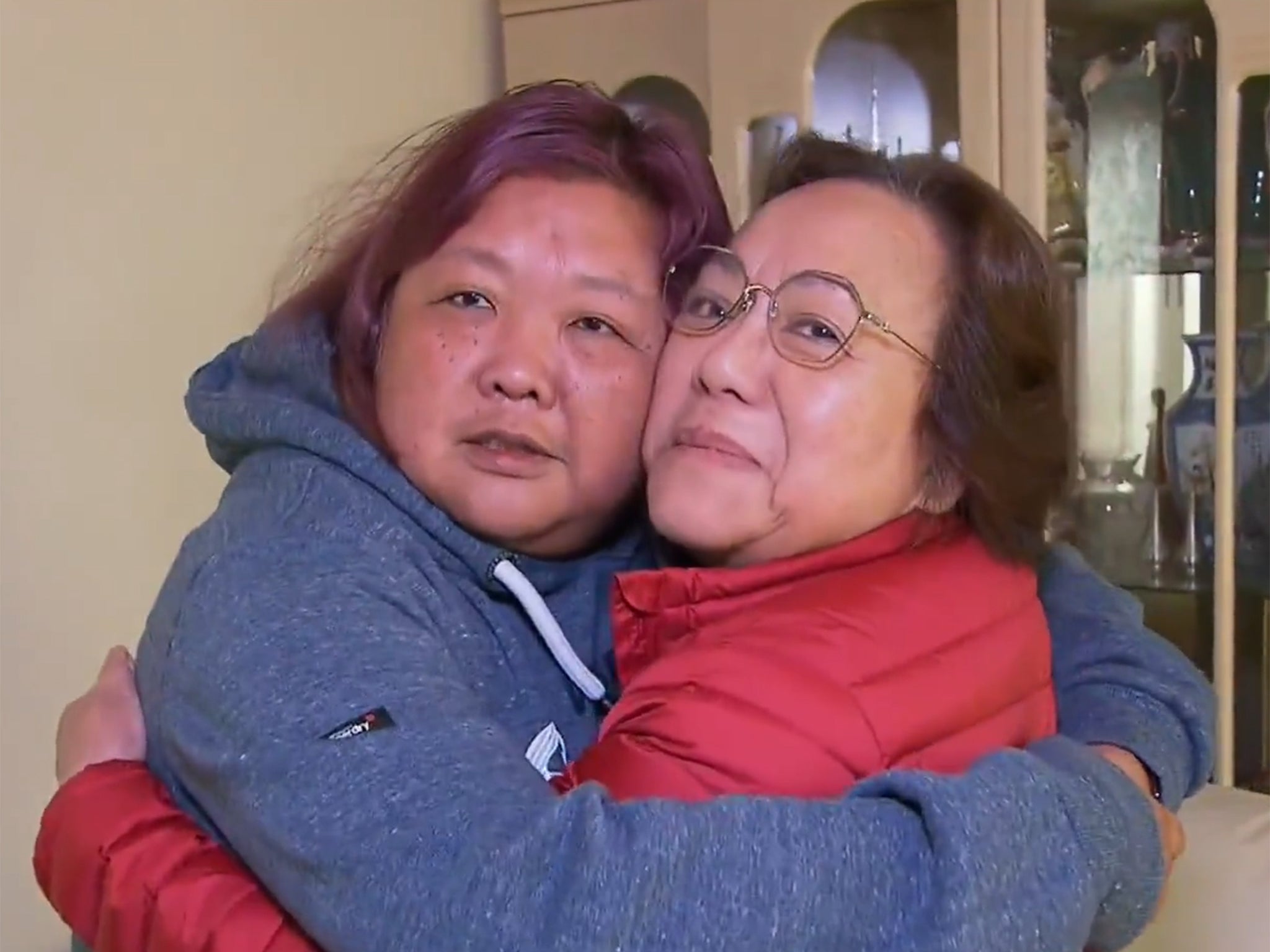 Ms Ip (left) and her mother embrace after the daughter’s ordeal