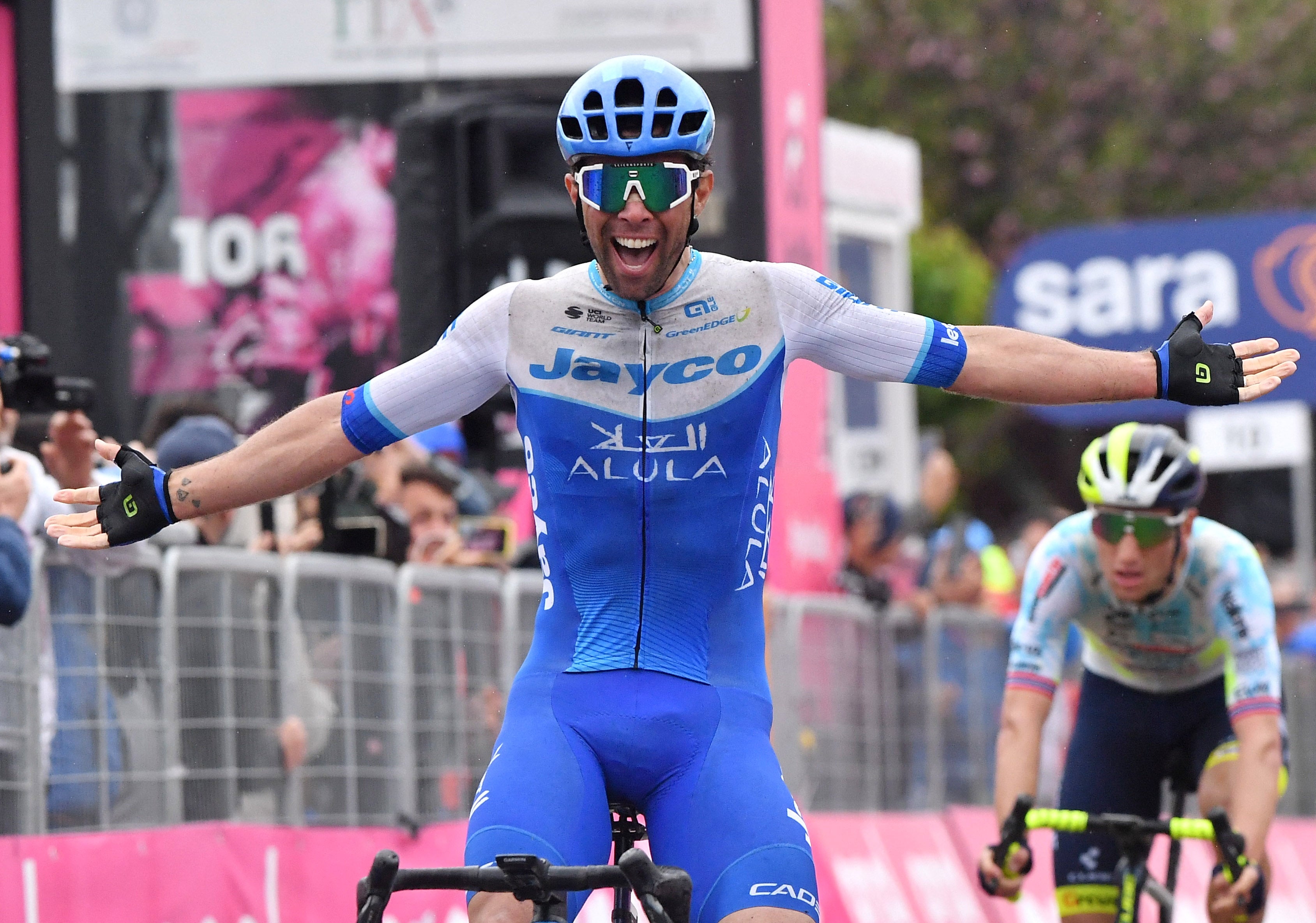 Michael Matthews celebrates as he crosses the finish line to win stage 3