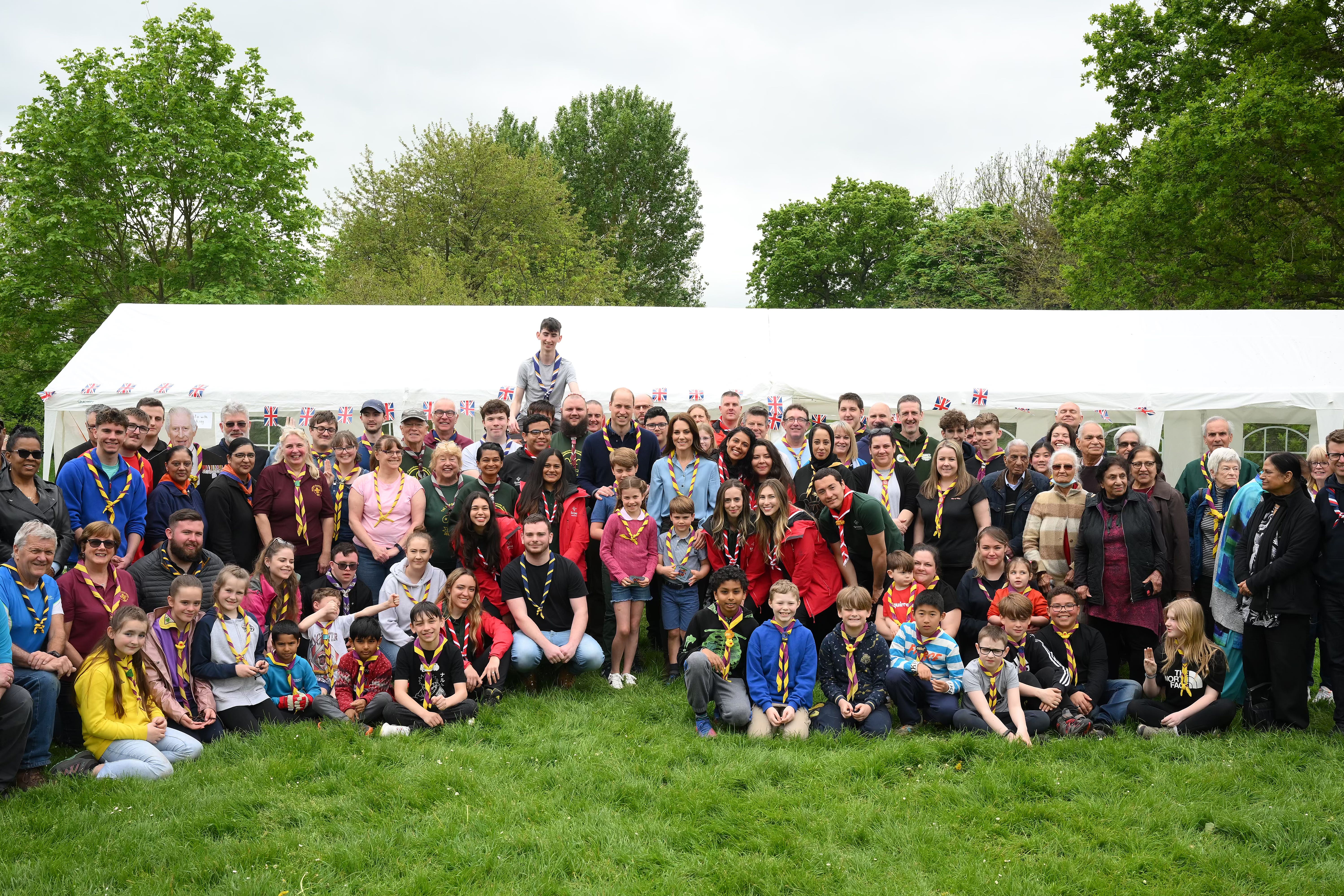 The Prince of Wales, Princess of Wales, Prince George, Princess Charlotte and Prince Louis pose with volunteers in Slough during their Big Help Out visit (Daniel Leal/PA)