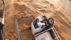 Daring rescue of driver trapped in rushing flood waters captured in bodycam footage