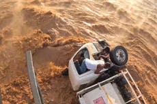 Daring rescue of driver trapped in rushing flood waters captured in bodycam footage