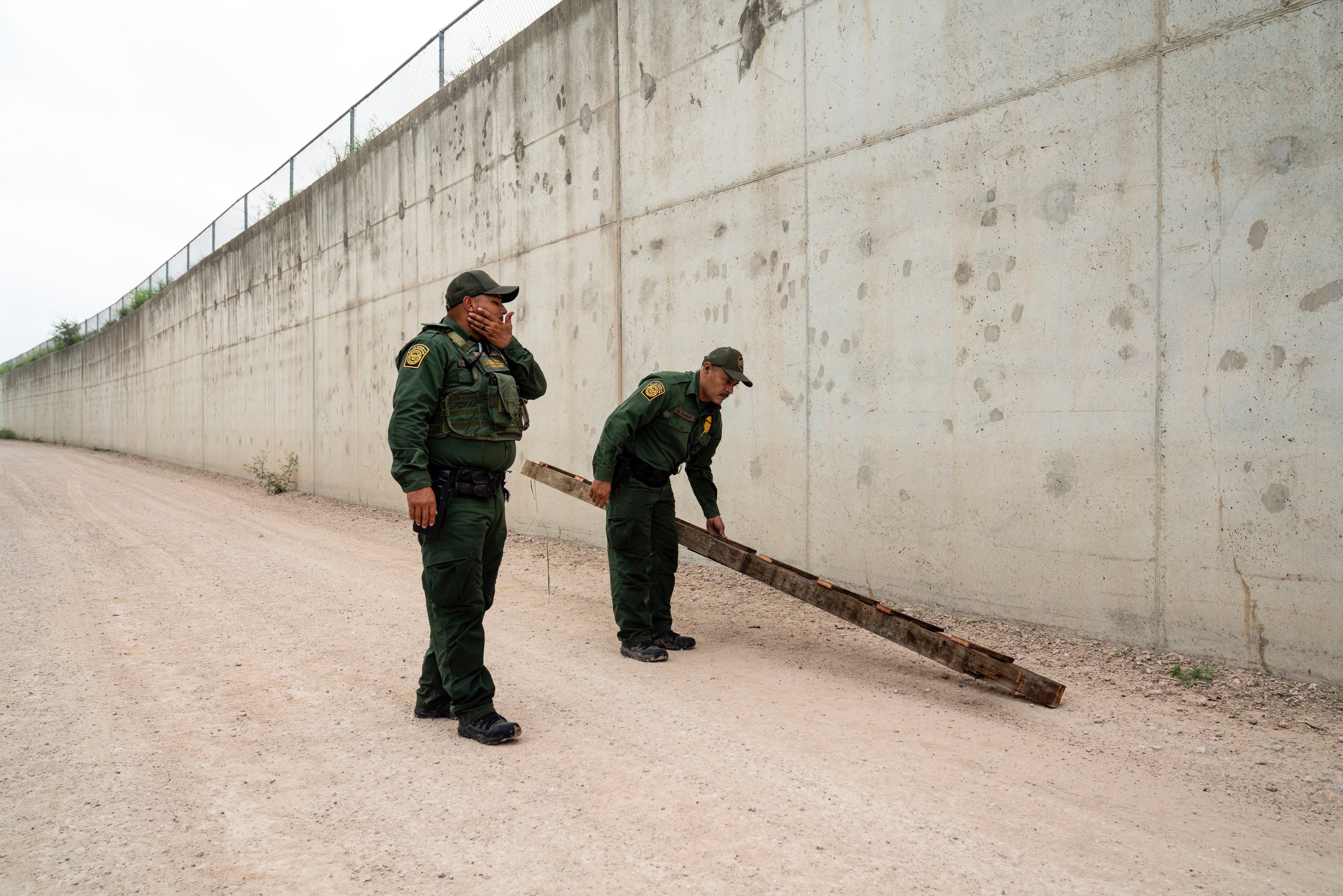 Simple tools ranging from household saws to ladders have been used to get through the federal border wall, pictured here in 2023, which cost an estimated $20m per mile to build