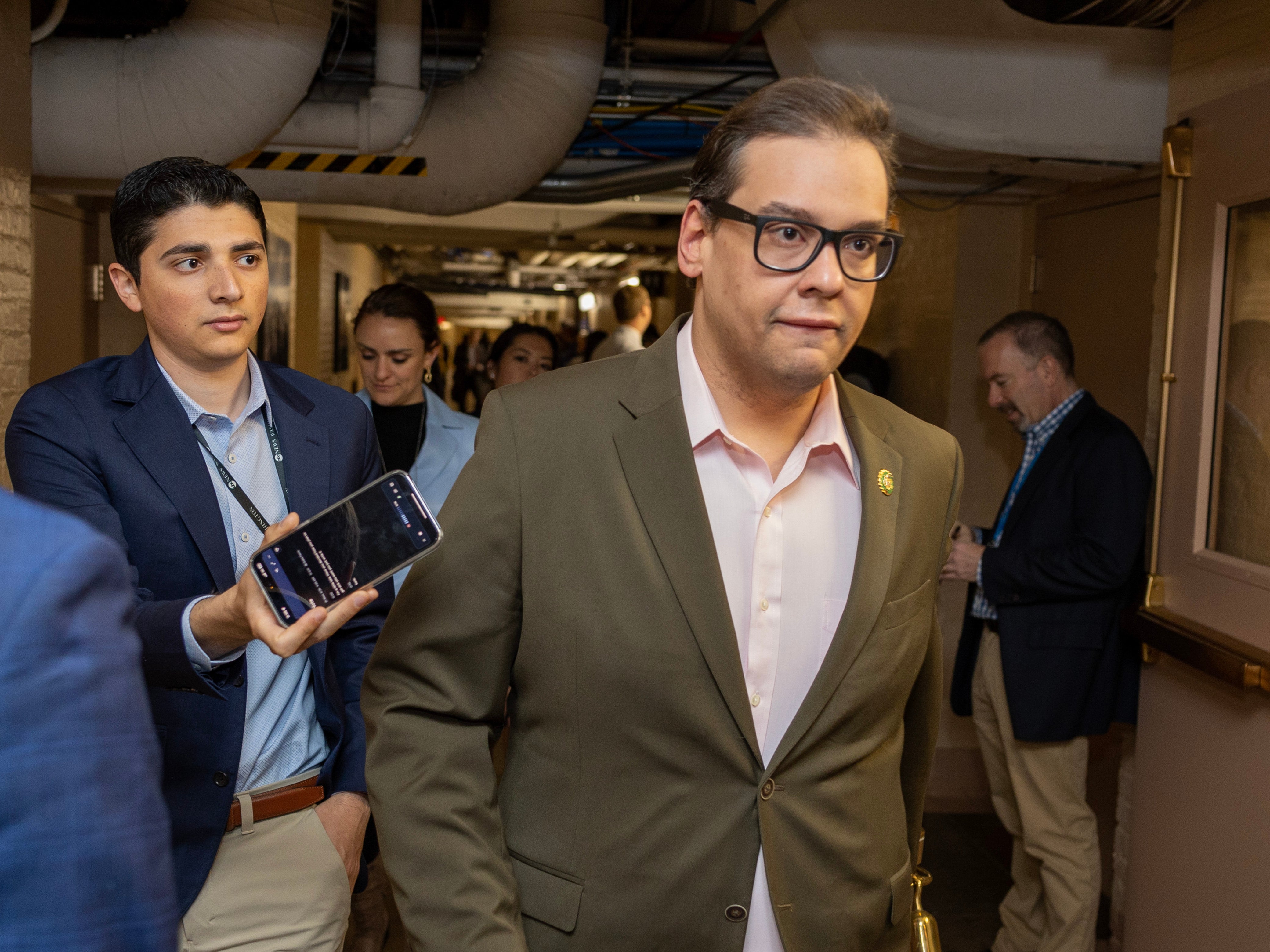 Rep. George Santos is followed by members of the media as he walks in the US Capitol on April 26, 2023 in Washington, DC