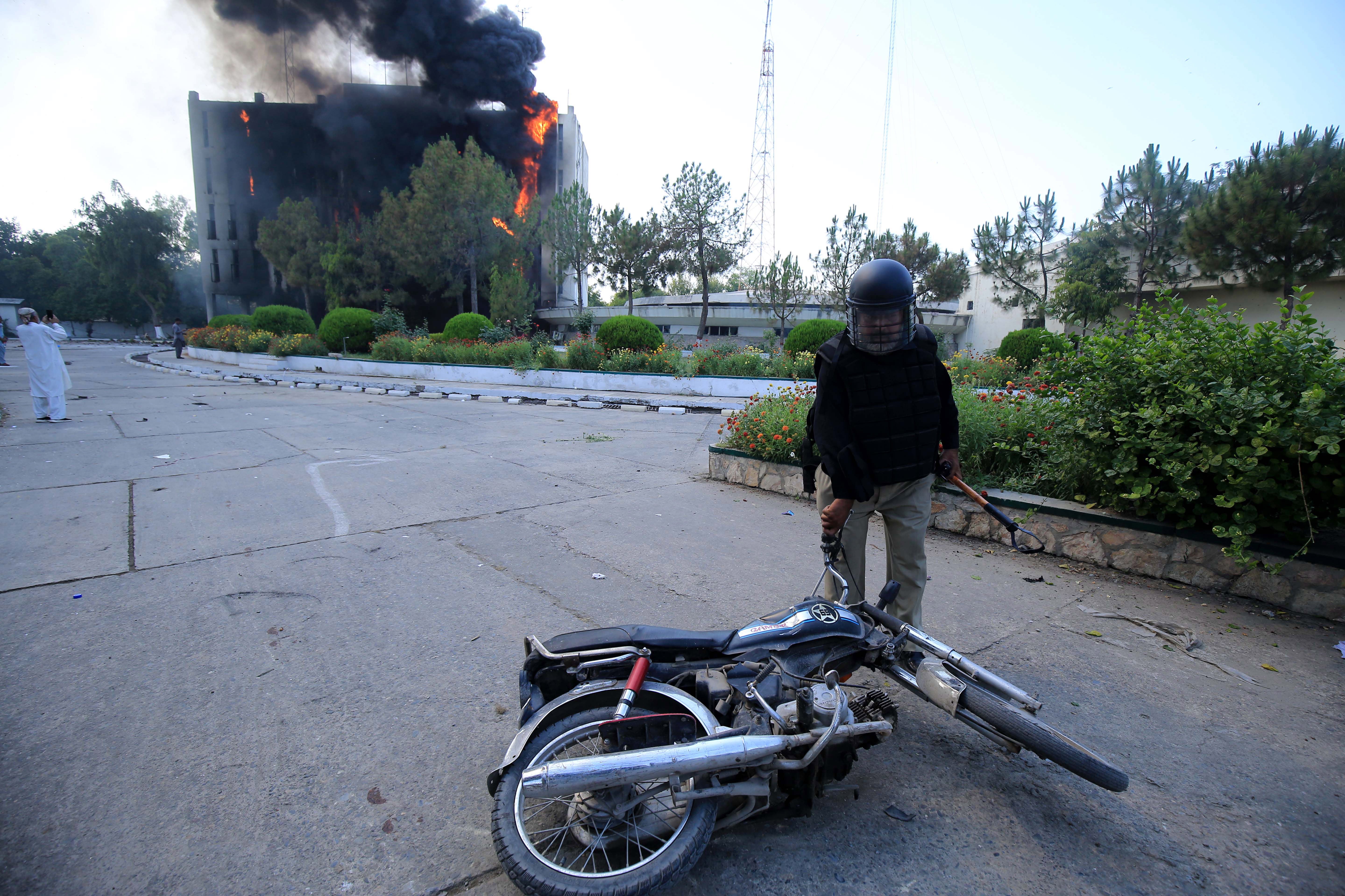 The Radio Pakistan building burns in Peshawar