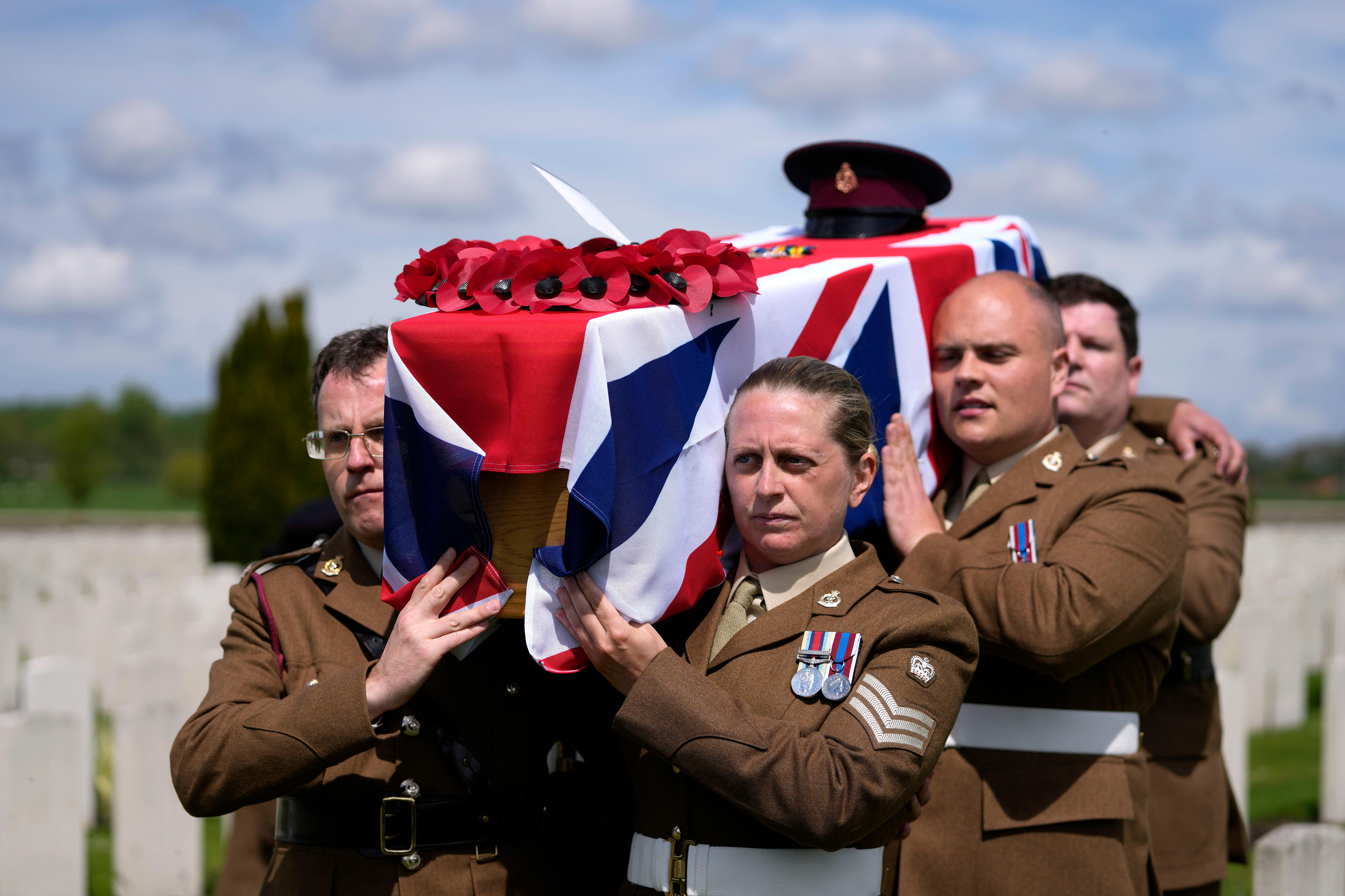 A bearer party carries the coffin of Private Robert Kenneth Malcolm, during a burial ceremony at the Commonwealth War Graves Commission’s Bedford House Cemetery in Ypres, Belgium (Virginia Mayo/AP)