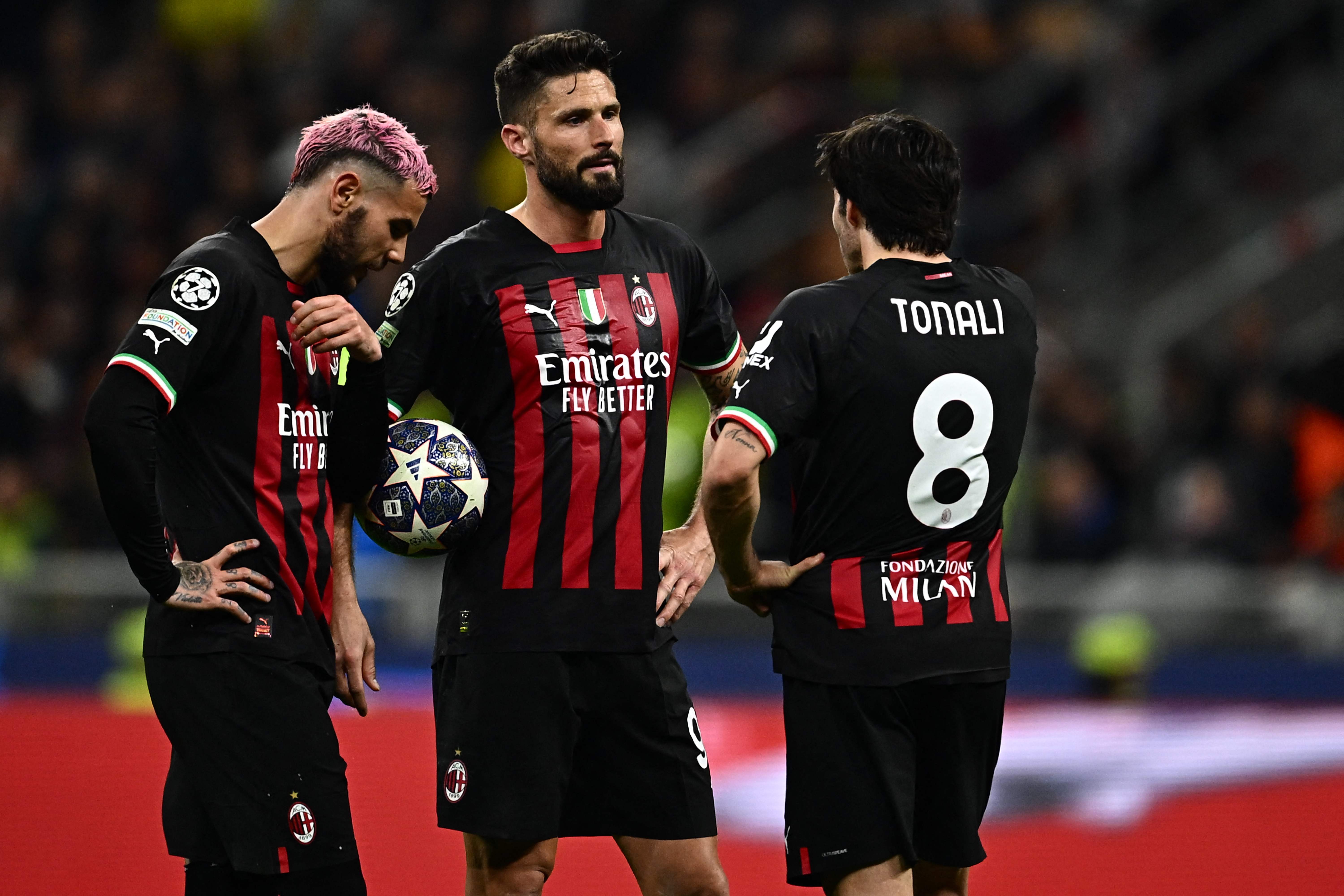 Milan players look on dejected at San Siro