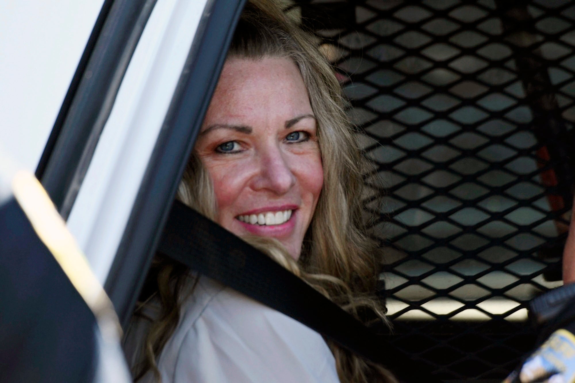 Lori Vallow smiles as she leaves a court hearing