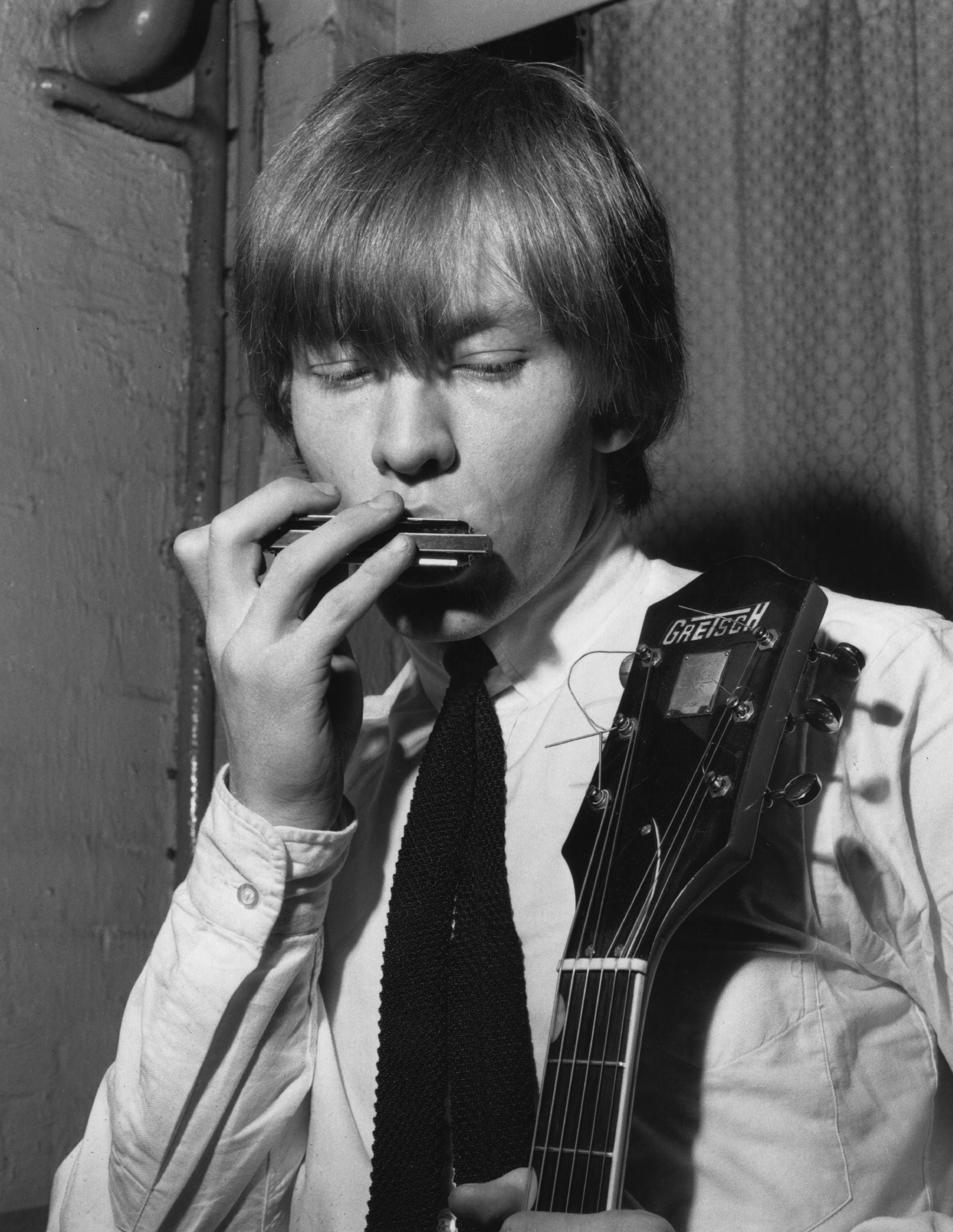 Multi-instrumentalist Jones plays a harmonica