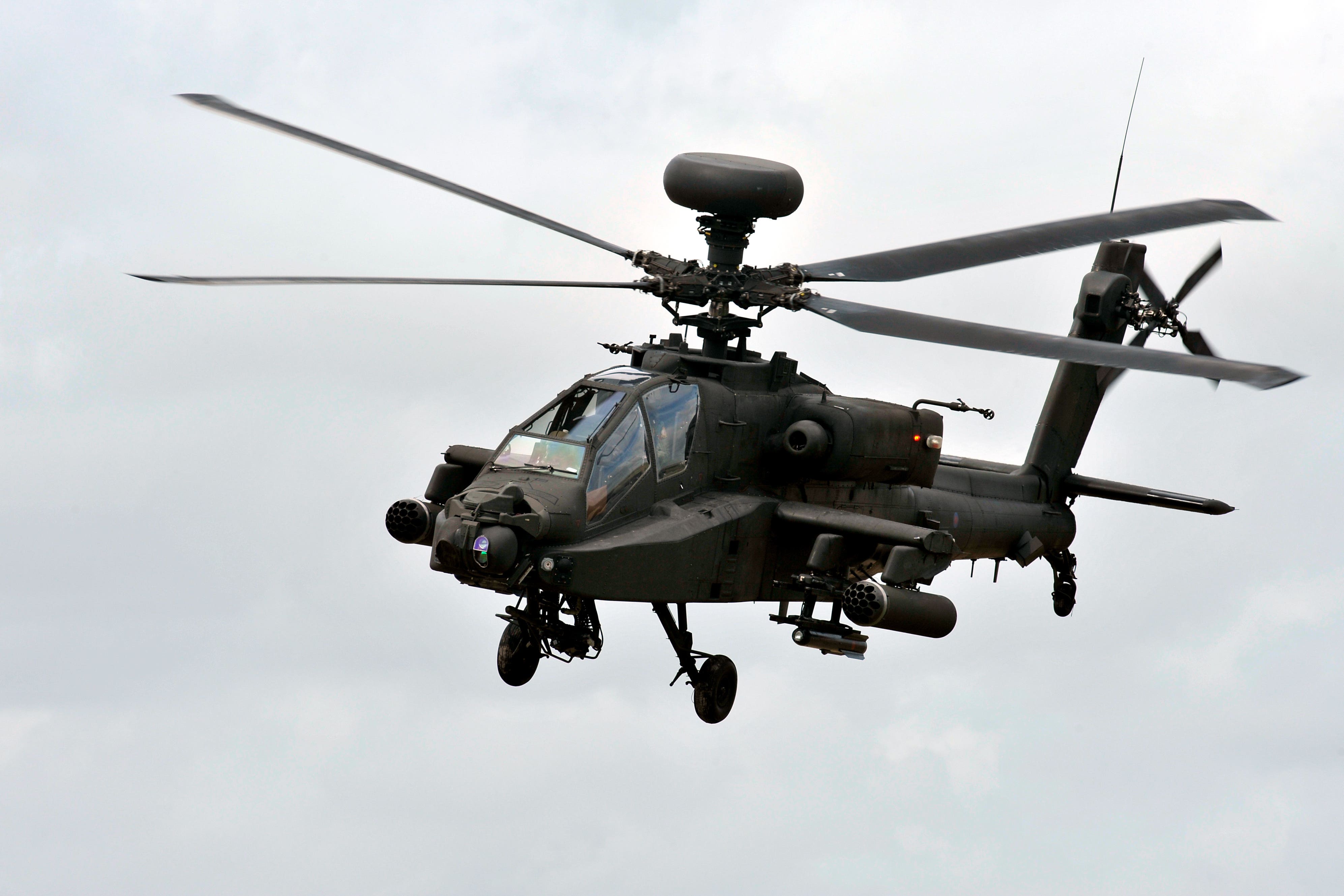 An Army Air Corps Apache Attack Helicopter flying during a training exercise on Salisbury Plain as preparation before deployment to Afghanistan (Ben Birchall/PA)