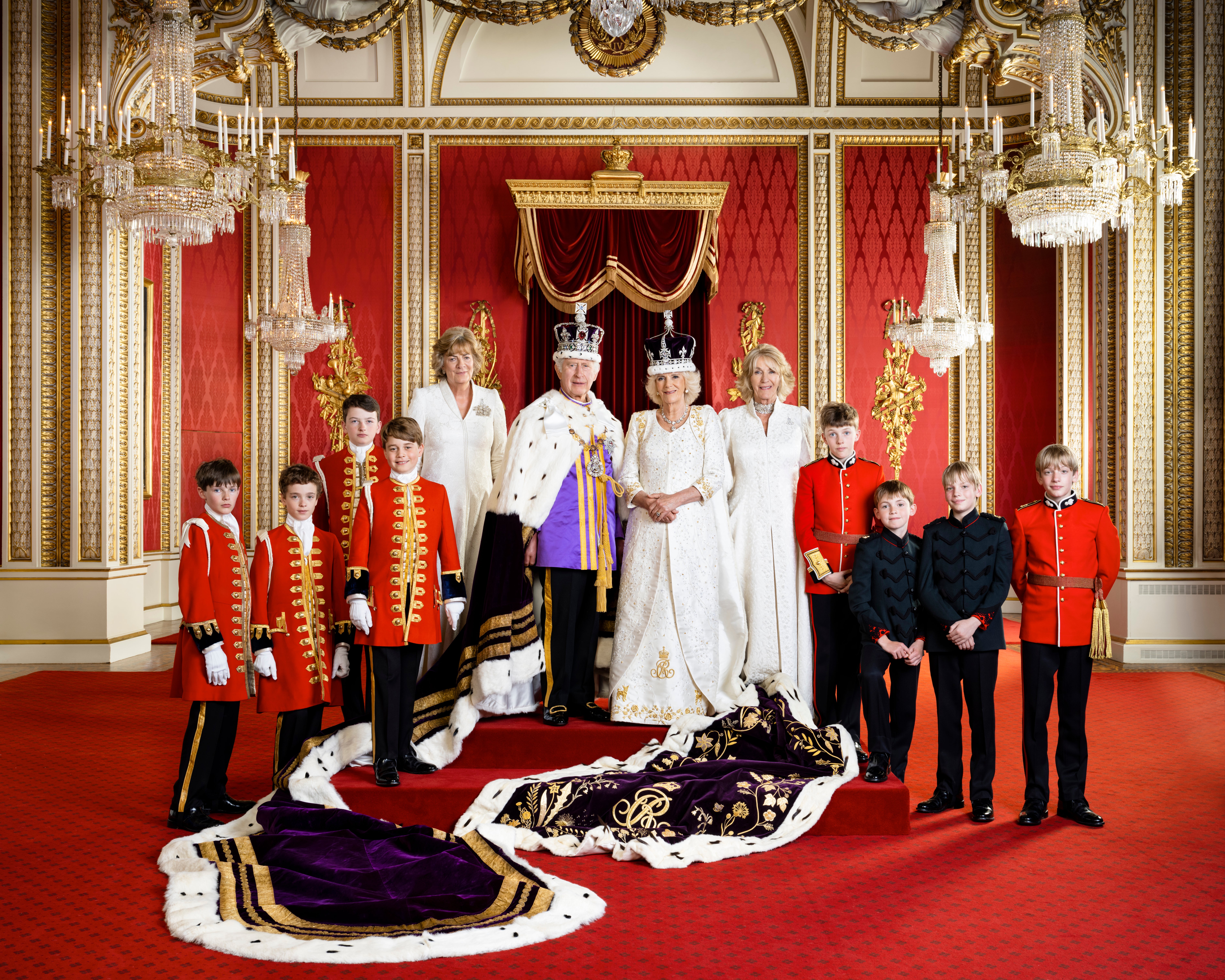 King Charles and Queen Camilla with their Pages of Honour and Ladies in Attendance on the day of the coronation in the Throne Room at Buckingham Palace. Pictured (left to right) Ralph Tollemache, Lord Oliver Cholmondeley, Nicholas Barclay, Prince George, the Marchioness of Lansdowne, King Charles III, Queen Camilla, the Queen’s sister Annabel Elliot, the Queen’s grandson Freddy Parker Bowles, the Queen’s great-nephew Arthur Elliot, and the Queen’s grandsons Gus Lopes and Louis Lopes