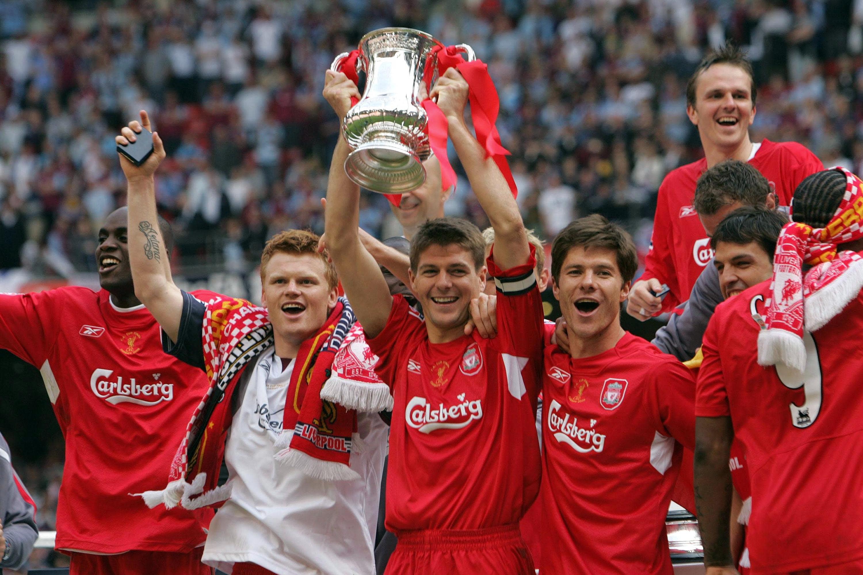 Liverpool players celebrate after winning the FA Cup (David Davies/PA)